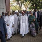 
              President-Elect Bola Tinubu, center, walks with his wife Oluremi Tinubu, center right, to receive his certificate at a ceremony in Abuja, Nigeria, Wednesday, March 1, 2023. Election officials declared Tinubu the winner of Nigeria's presidential election Wednesday, keeping the ruling party in power in Africa's most populous nation. (AP Photo/Ben Curtis)
            