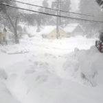 
              Snow blankets a street in Crestline, Calif., Saturday, Feb. 25, 2023. (AP Photo/Christian Vinceneux)
            