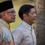 
              Malaysian Prime Minister Anwar Ibrahim, left, and Philippine President Ferdinand Marcos Jr. review an honor guard during a welcome ceremony at Malacanang Palace on Wednesday, March 1, 2023 in Manila, Philippines. (Ezra Acayan/Pool Photo via AP)
            