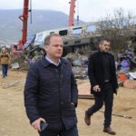 
              Transport Minister Kostas Karamanlis visits the location of a collision in Tempe, about 376 kilometres (235 miles) north of Athens, near Larissa city, Greece, Wednesday, March 1, 2023. Karamanlis resigned Wednesday, saying he felt it was his "duty" to step down. A passenger train carrying hundreds of people, including many university students returning home from holiday, has collided at high speed with an oncoming freight train. (George Kidonas/InTime News via AP)
            