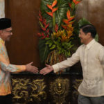
              Philippine President Philippine President Ferdinand Marcos Jr., right, shakes hands with Malaysia's Prime Minister Anwar Ibrahim after delivering their statements to the press at the Malacanang presidential palace in Manila, Philippines on Wednesday Mar. 1, 2023. (AP Photo/Aaron Favila, Pool)
            
