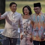 
              Malaysian Prime Minister Anwar Ibrahim, right, walks together with Philippine President Ferdinand Marcos Jr. and First Lady Liza Araneta Marcos during a welcome ceremony at Malacanang Palace on Wednesday, March 1, 2023 in Manila, Philippines. (Ezra Acayan/Pool Photo via AP)
            