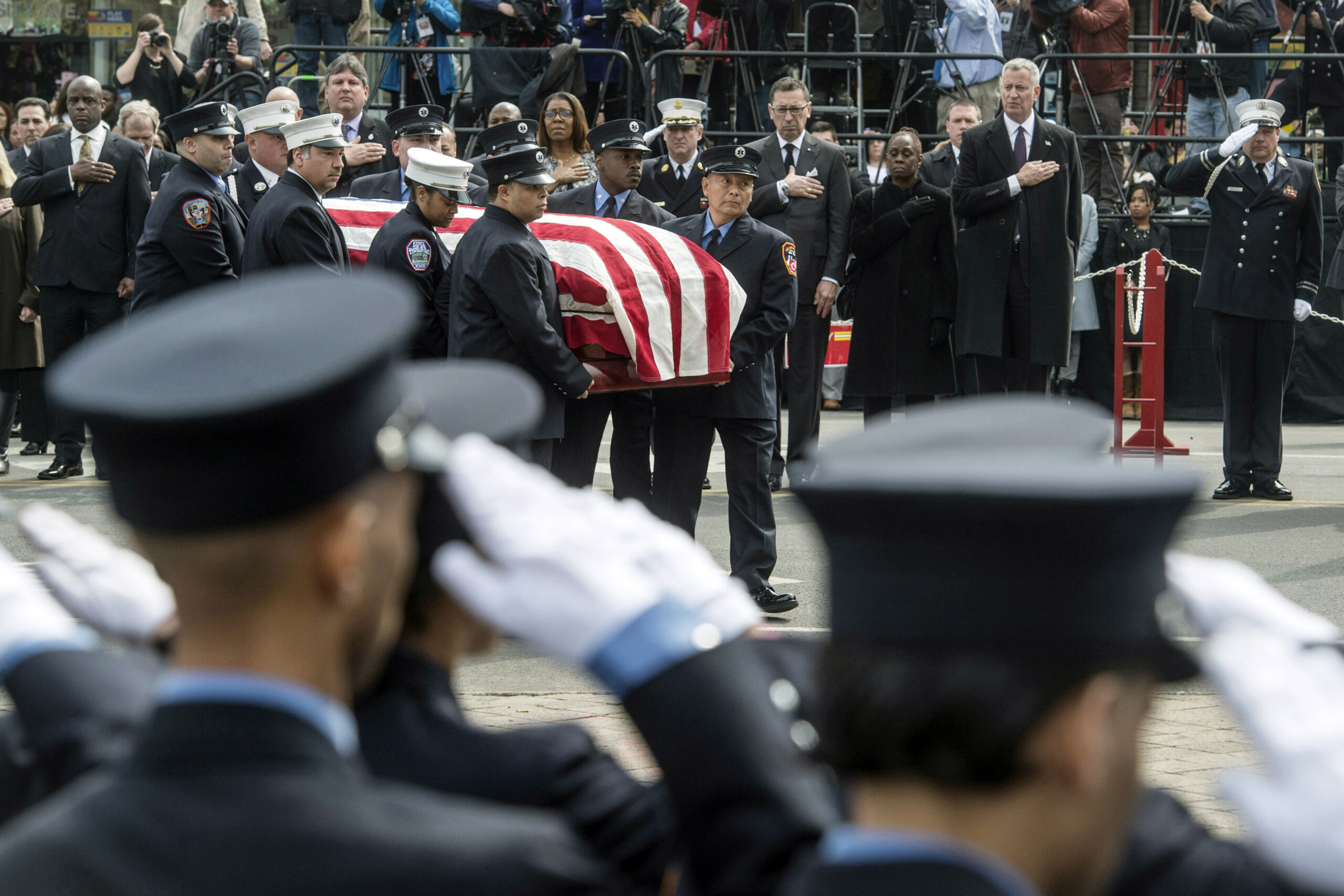 FILE - In this photo provided by the New York City Mayor's Office, pallbearers from the New York Ci...