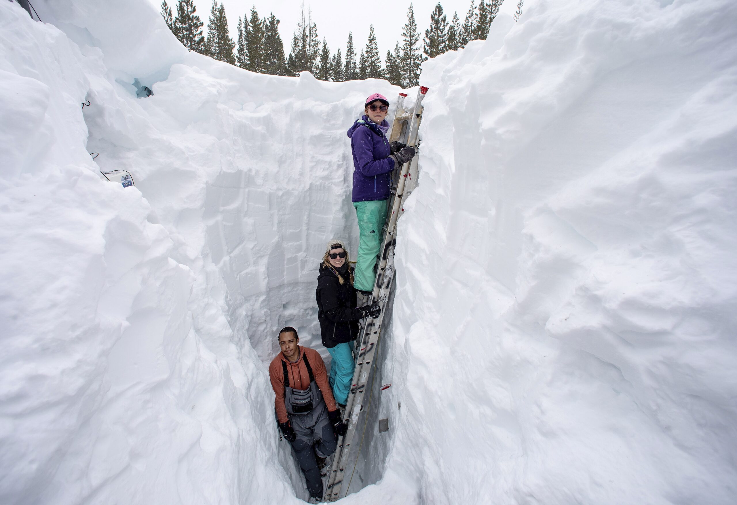 FILE - Working inside a nearly 18-foot-deep snow pit at the UC Berkeley Central Sierra Snow Lab, fr...