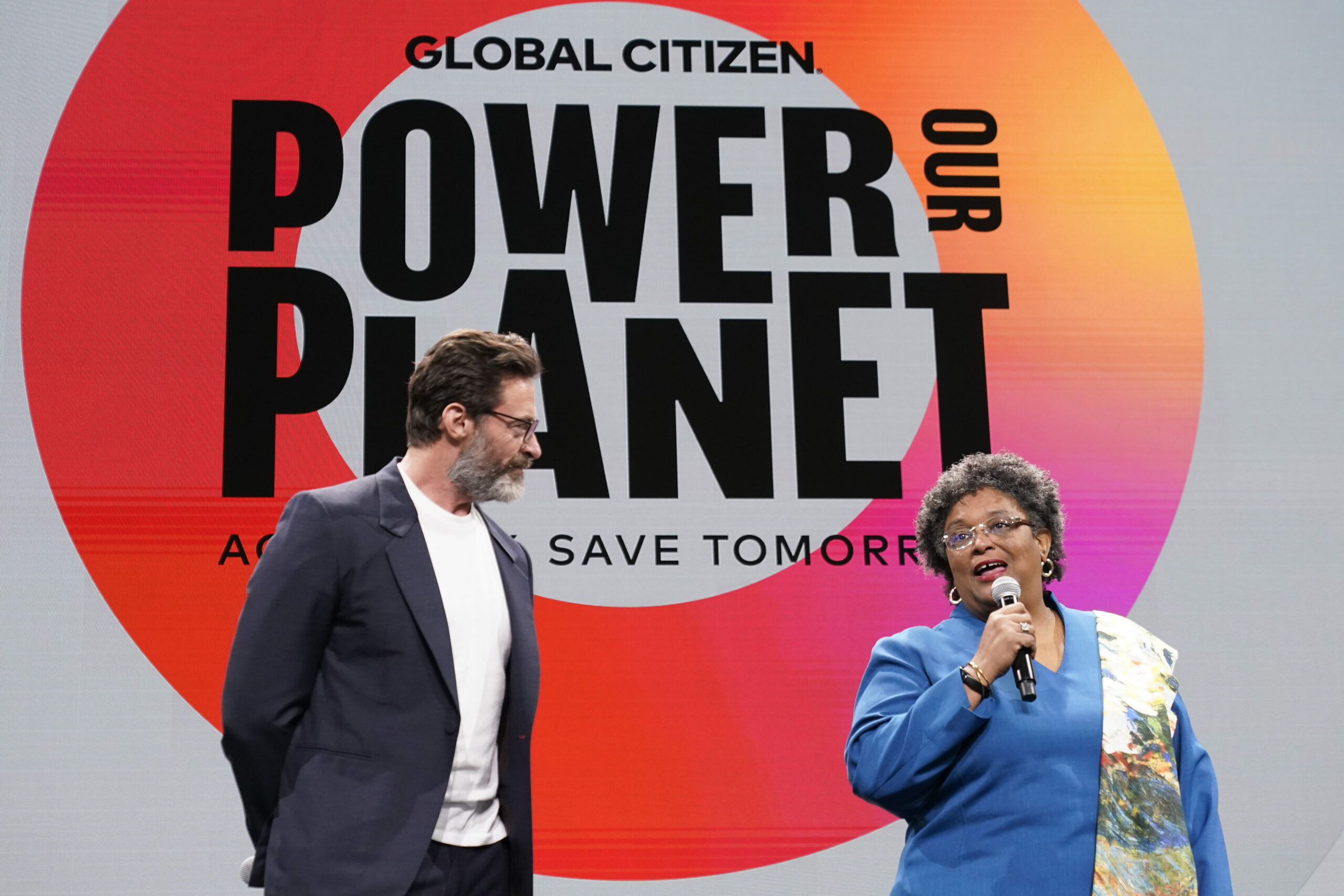 Actor Hugh Jackman, left, is joined by Prime Minister of Barbados Mia Mottley onstage at the Global...