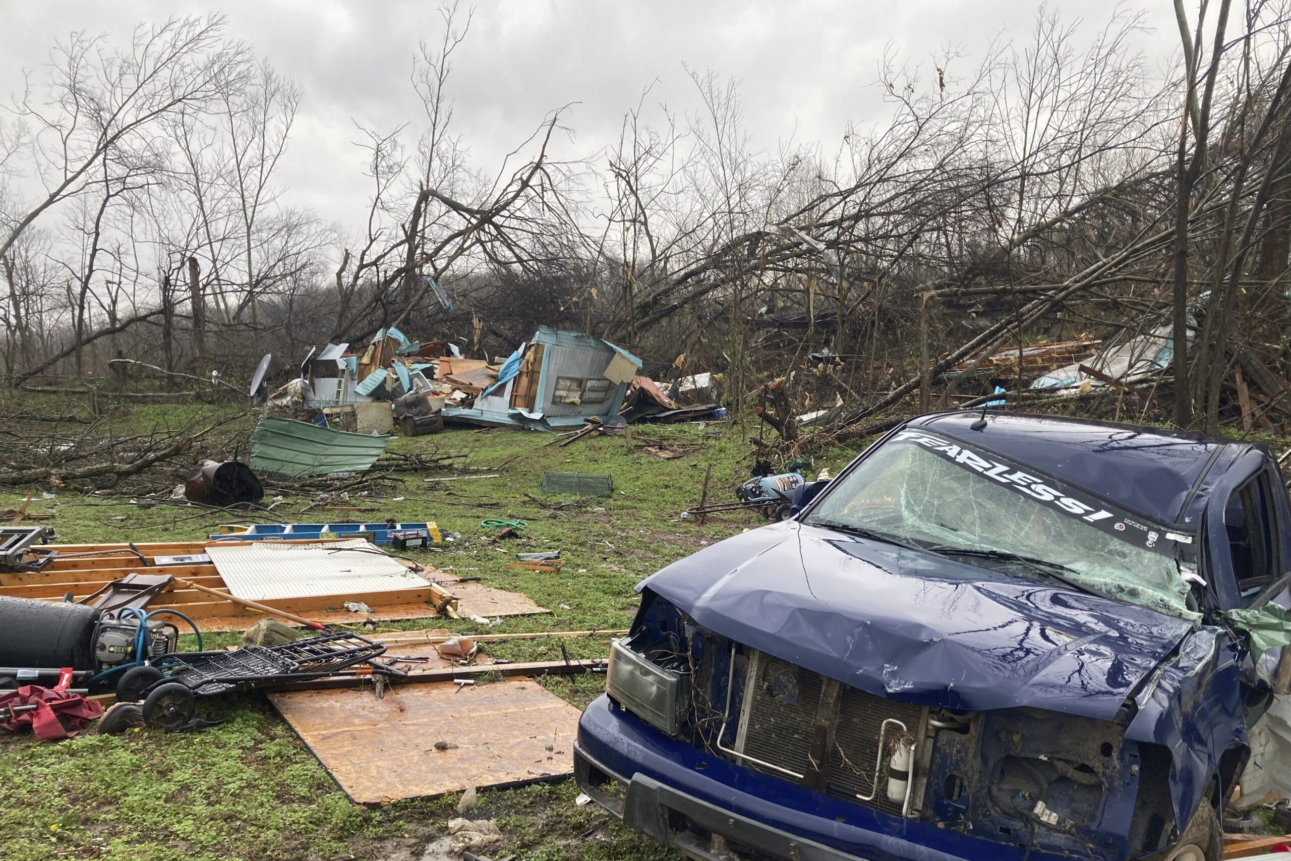 FILE - The remains of a mobile home that was torn apart by a tornado cover the ground in Glen Allen...