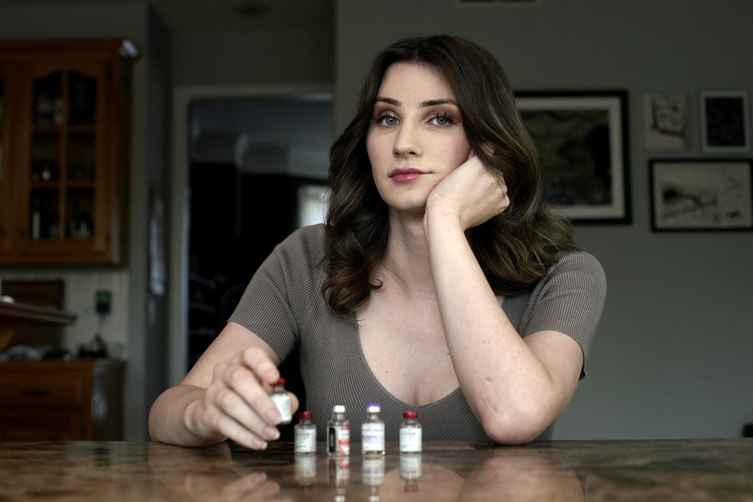 Transgender woman Stacy Cay displays some of the hormone therapy drugs she has stockpiled in fear o...