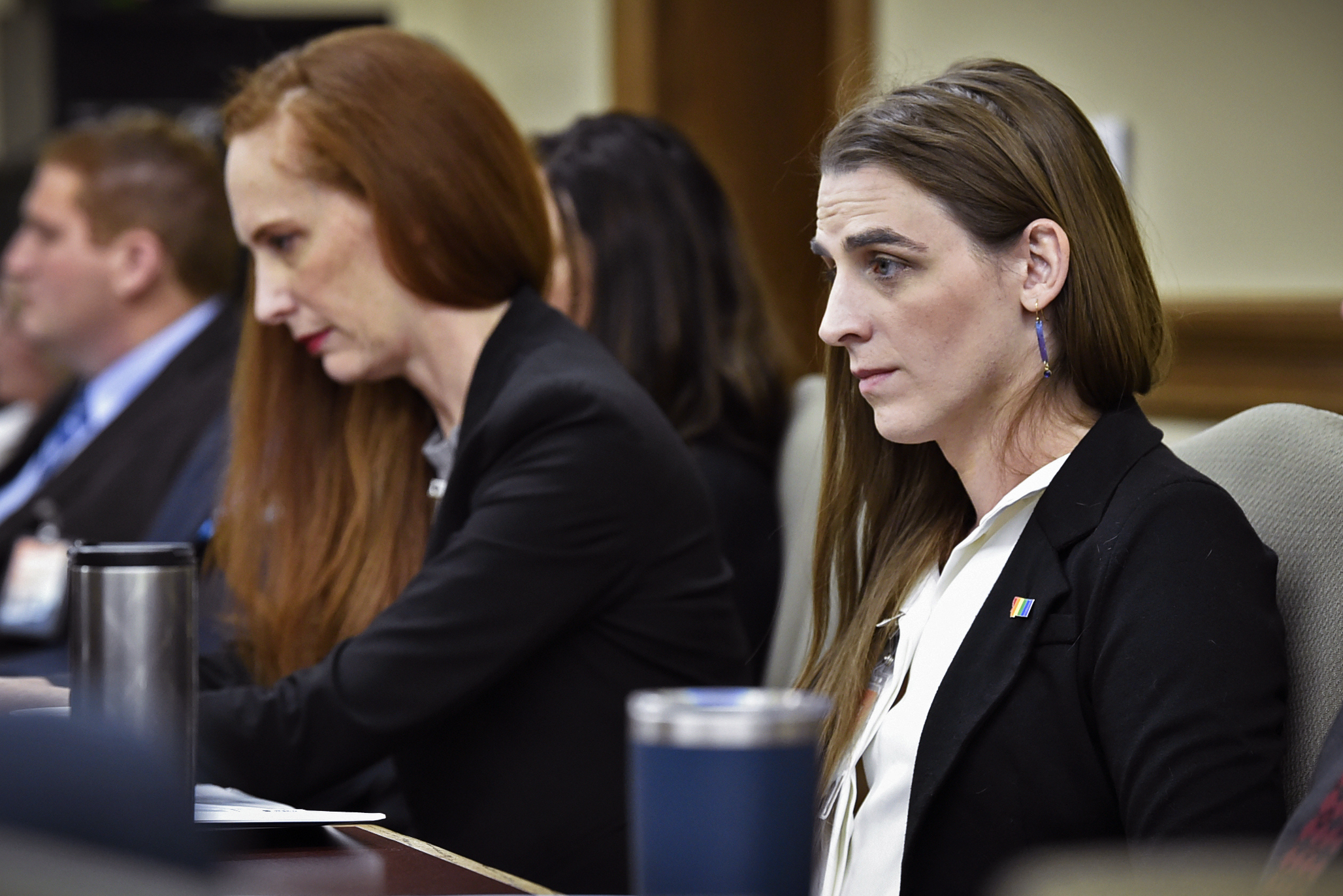 FILE - Zooey Zephyr, right, attends a legislative training session at the state Capitol in Helena, ...