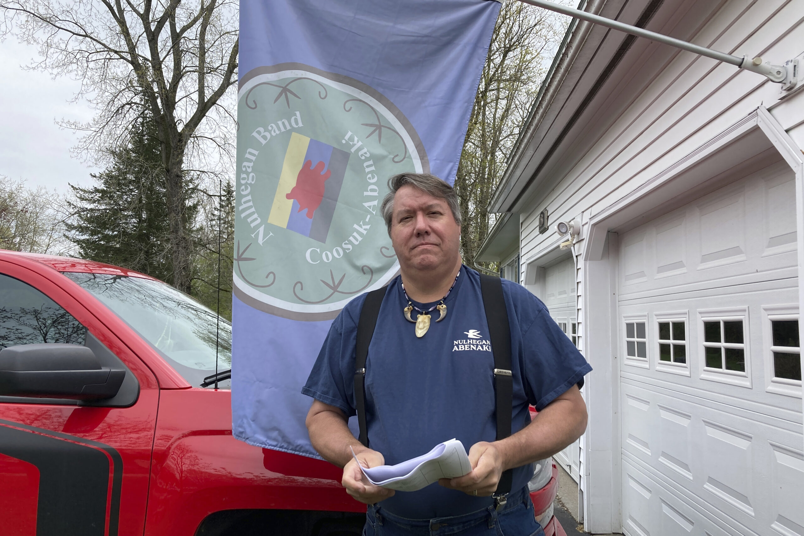 Don Stevens, chief of the Nulhegan Band of the Coosuk-Abenaki Nation, holds a stack of papers at hi...