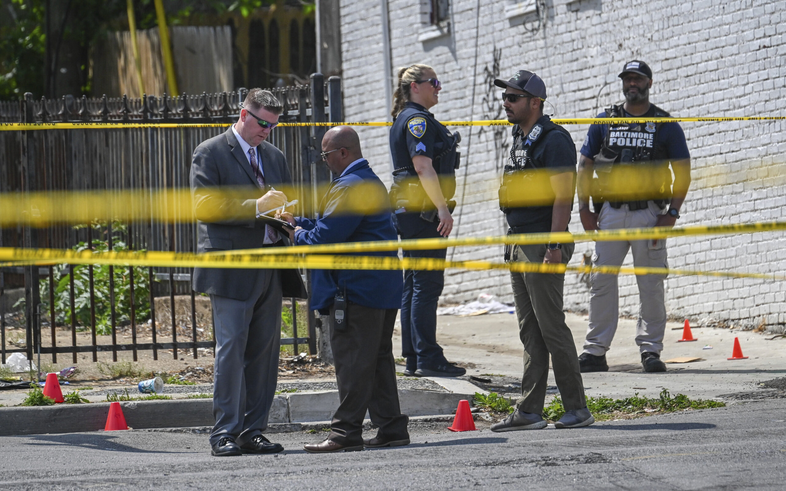 Baltimore Police investigate the scene of an officer involved shooting in the Shipley Hill neighbor...