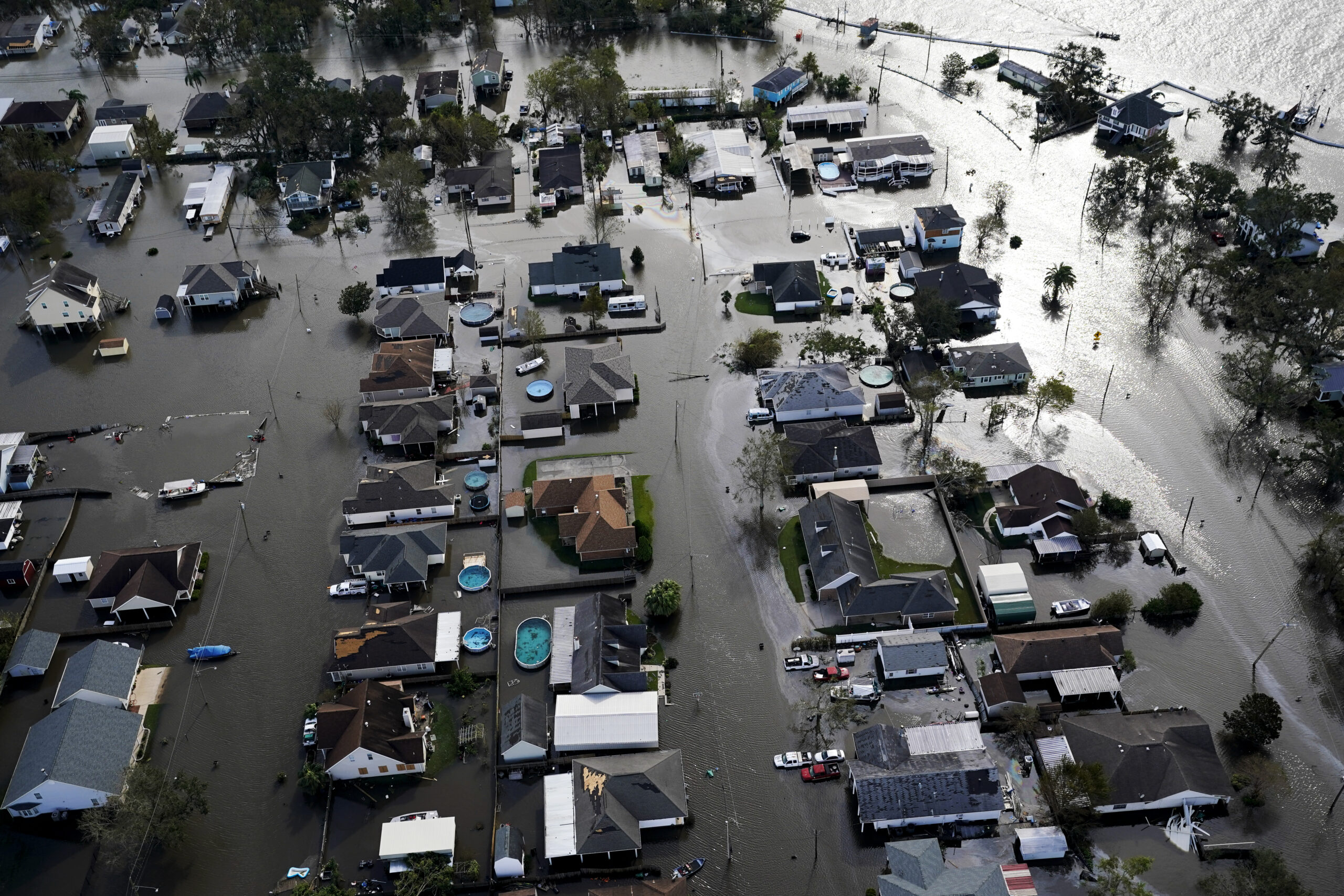 FILE - Homes are flooded in the aftermath of Hurricane Ida, Aug. 30, 2021, in Jean Lafitte, La. (AP...