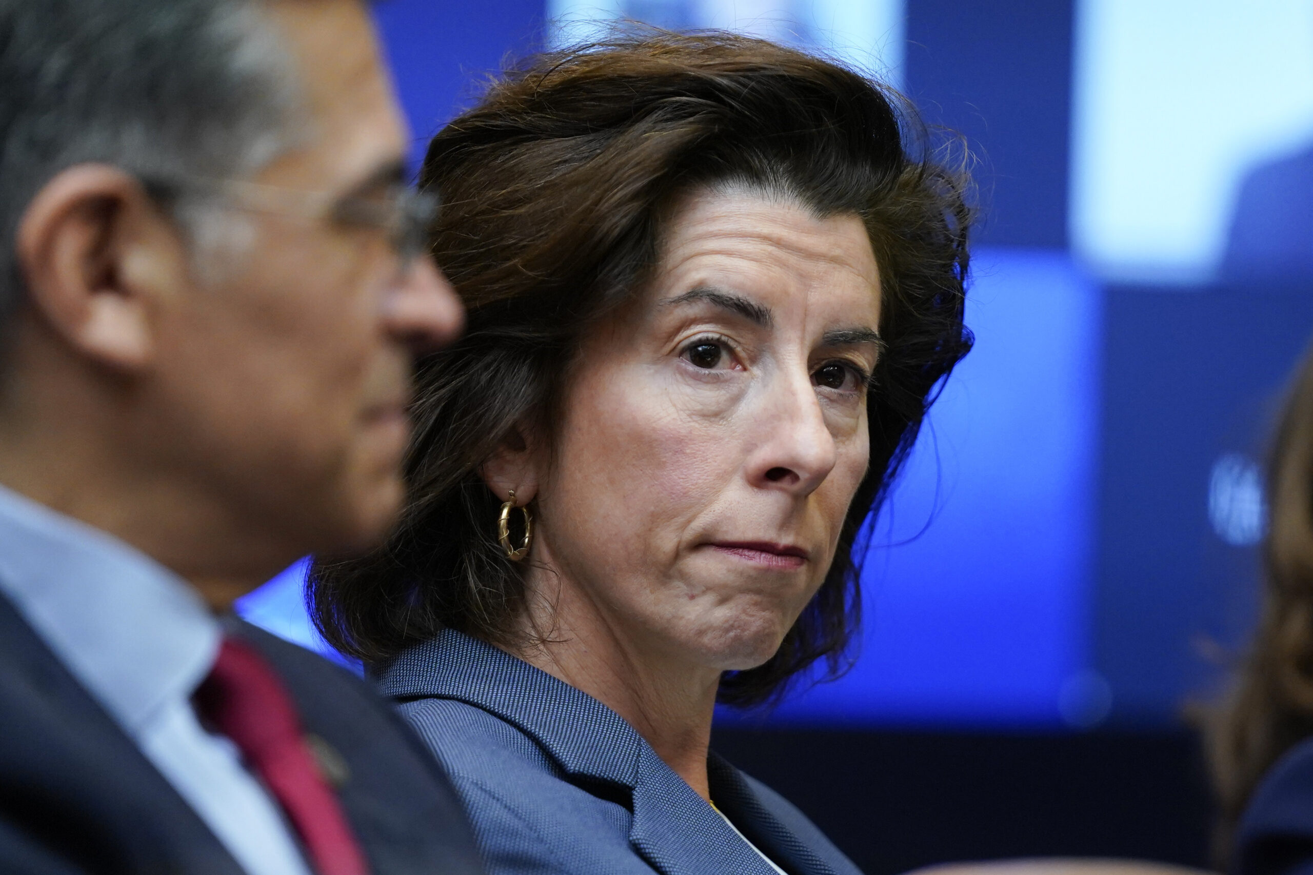 FILE - Commerce Secretary Gina Raimondo listens during a meeting with President Joe Biden's "Invest...