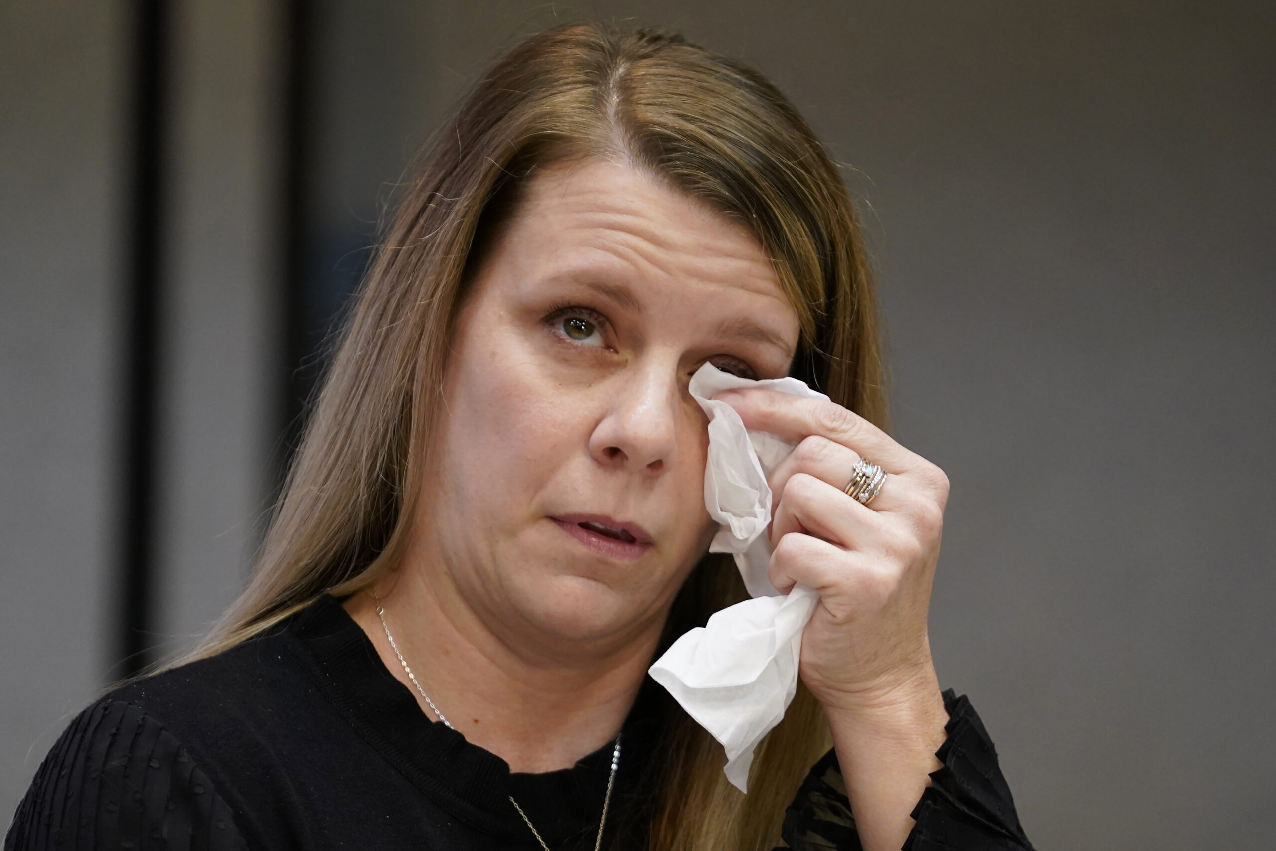 FILE - Gabby Petito's mother Nichole Schmidt, wipes a tear from her face during a news conference o...