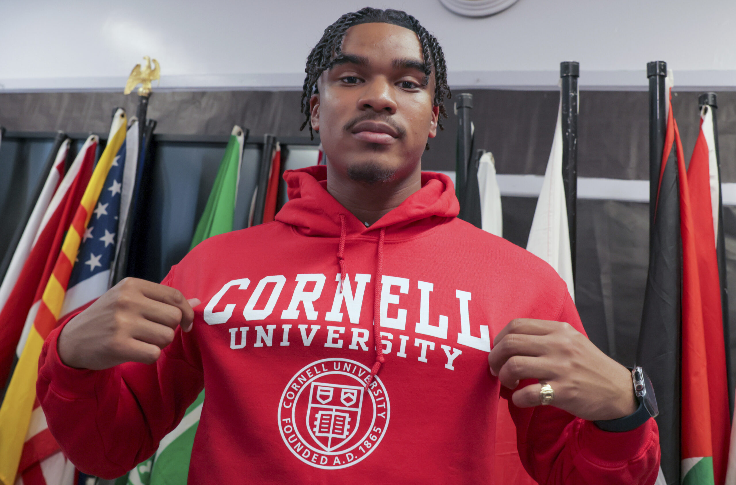 Dennis "Maliq" Barnes, 16, announces that he will be attending Cornell University during a news con...