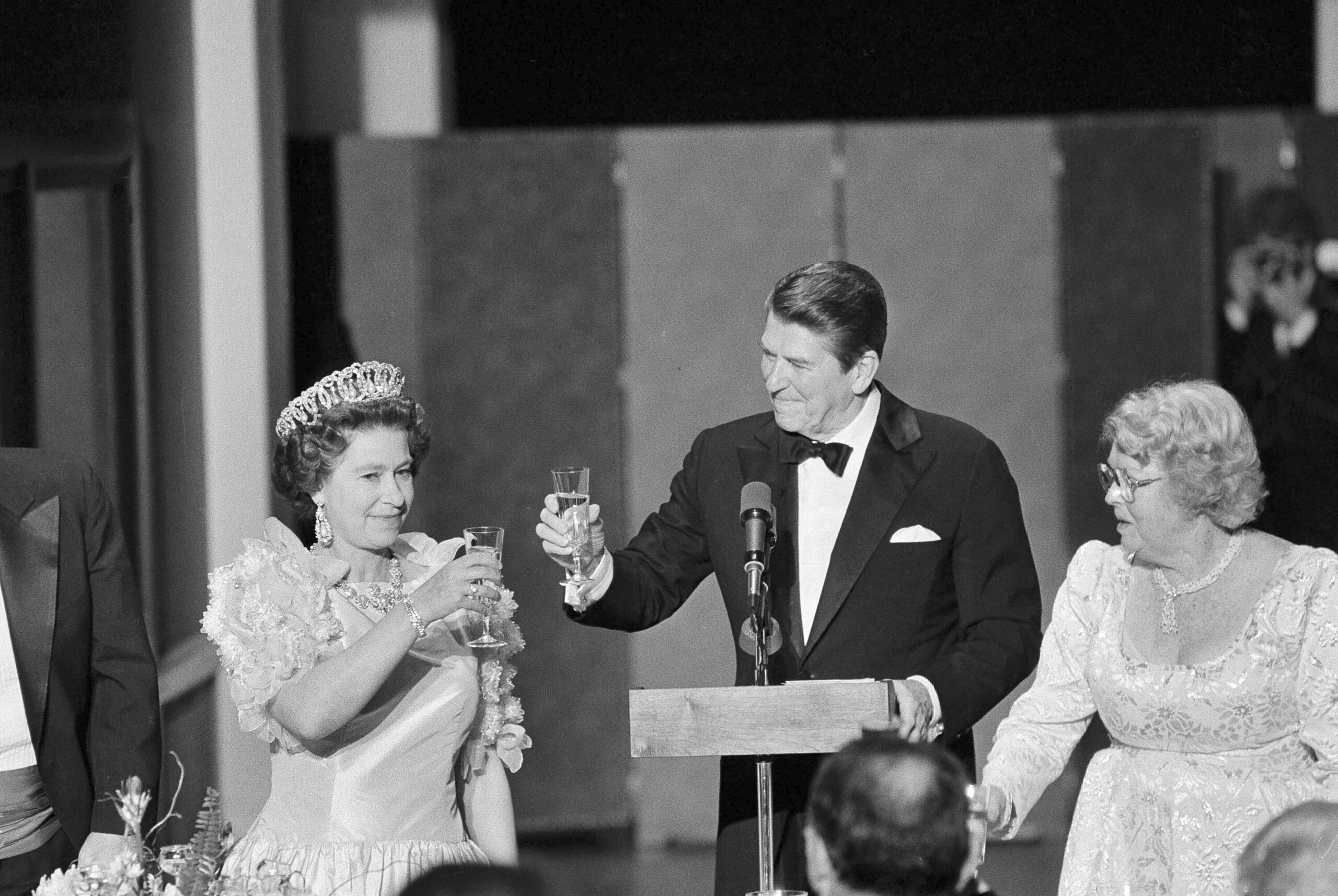FILE - President Ronald Reagan and Queen Elizabeth II raise their glasses in a toast during a state...