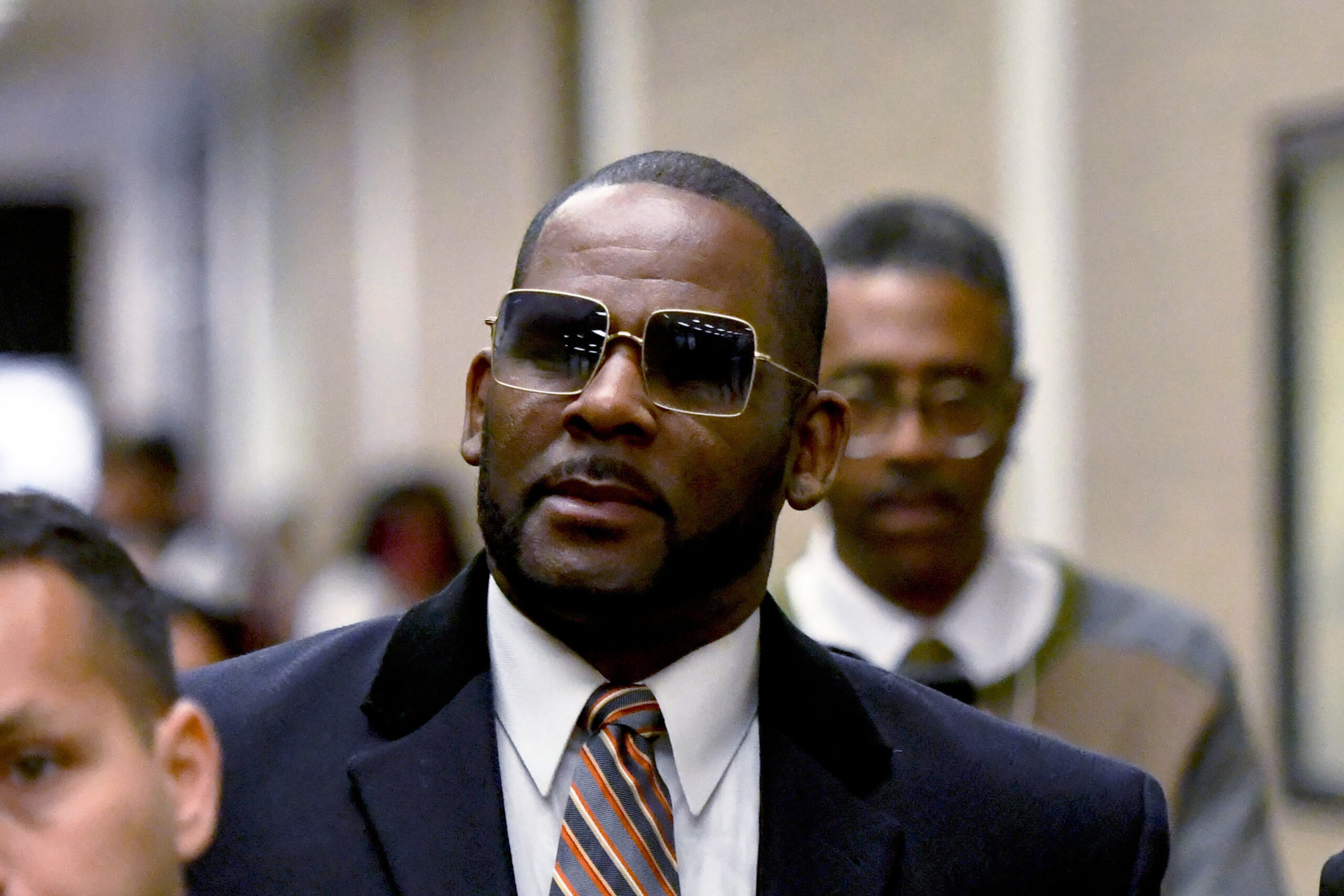 FILE - R. Kelly leaves the Daley Center after a hearing in his child support case May 8, 2019, in C...