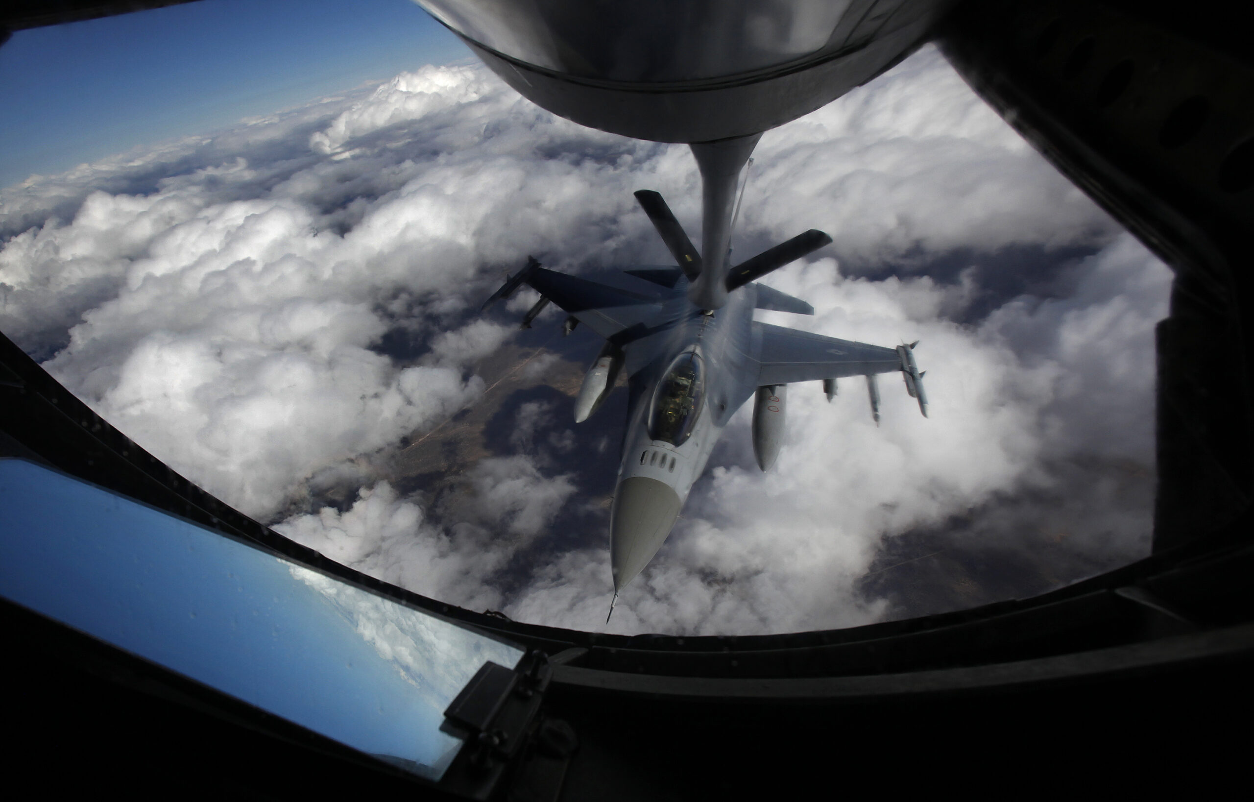 FILE - A U.S. Air Force F-16 refuels in mid-flight from a KC-135 Stratotanker during a Red Flag exe...