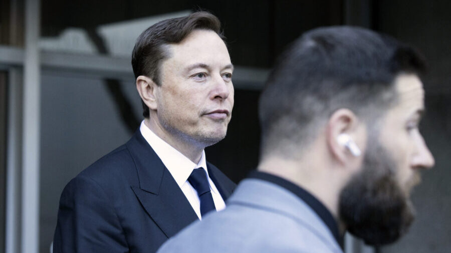 FILE - Elon Musk leave the Phillip Burton Federal Building and United States Court House in San Fra...