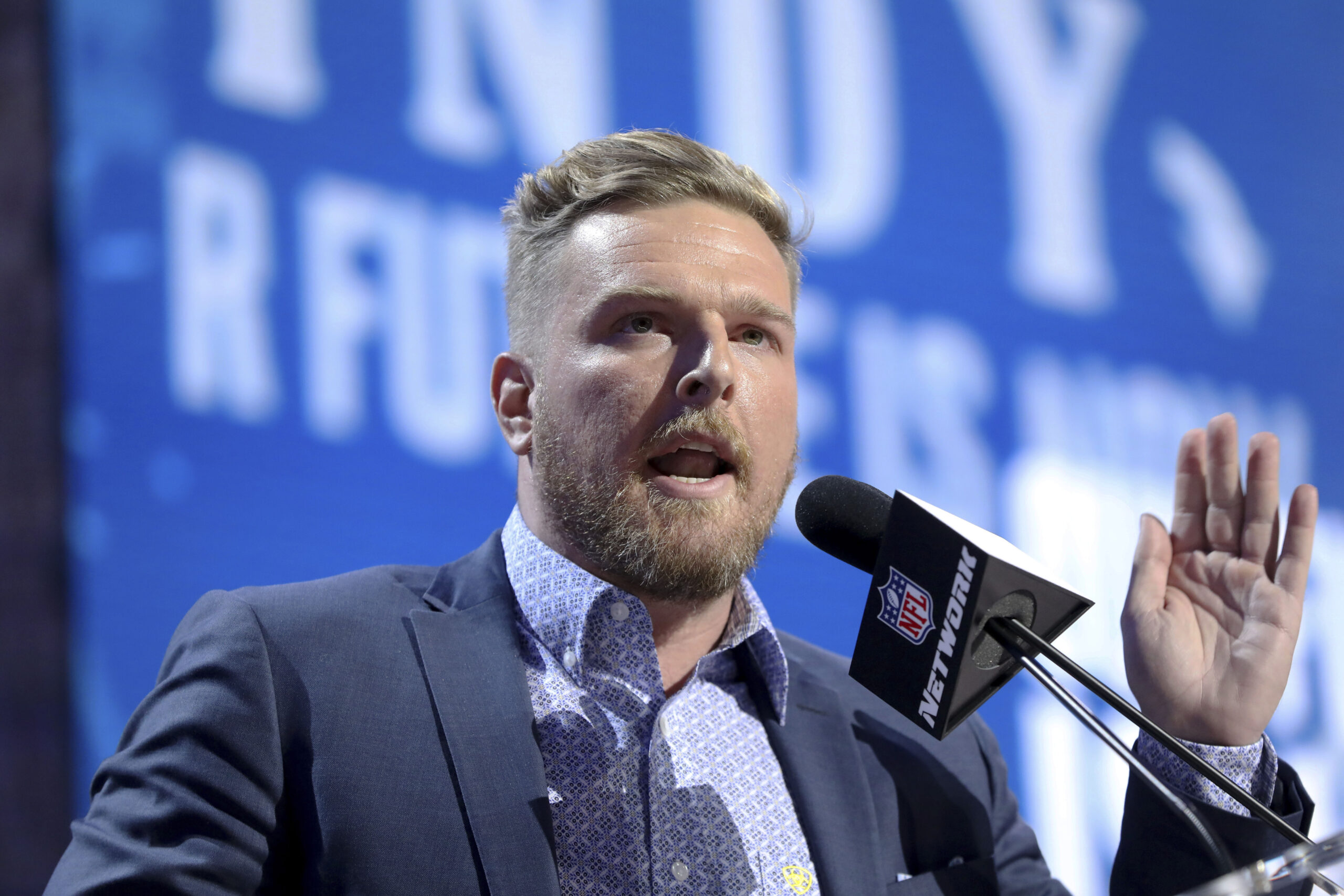 FILE - Former Indianapolis Colts player Pat McAfee announces the Colts' third round pick at the NFL...