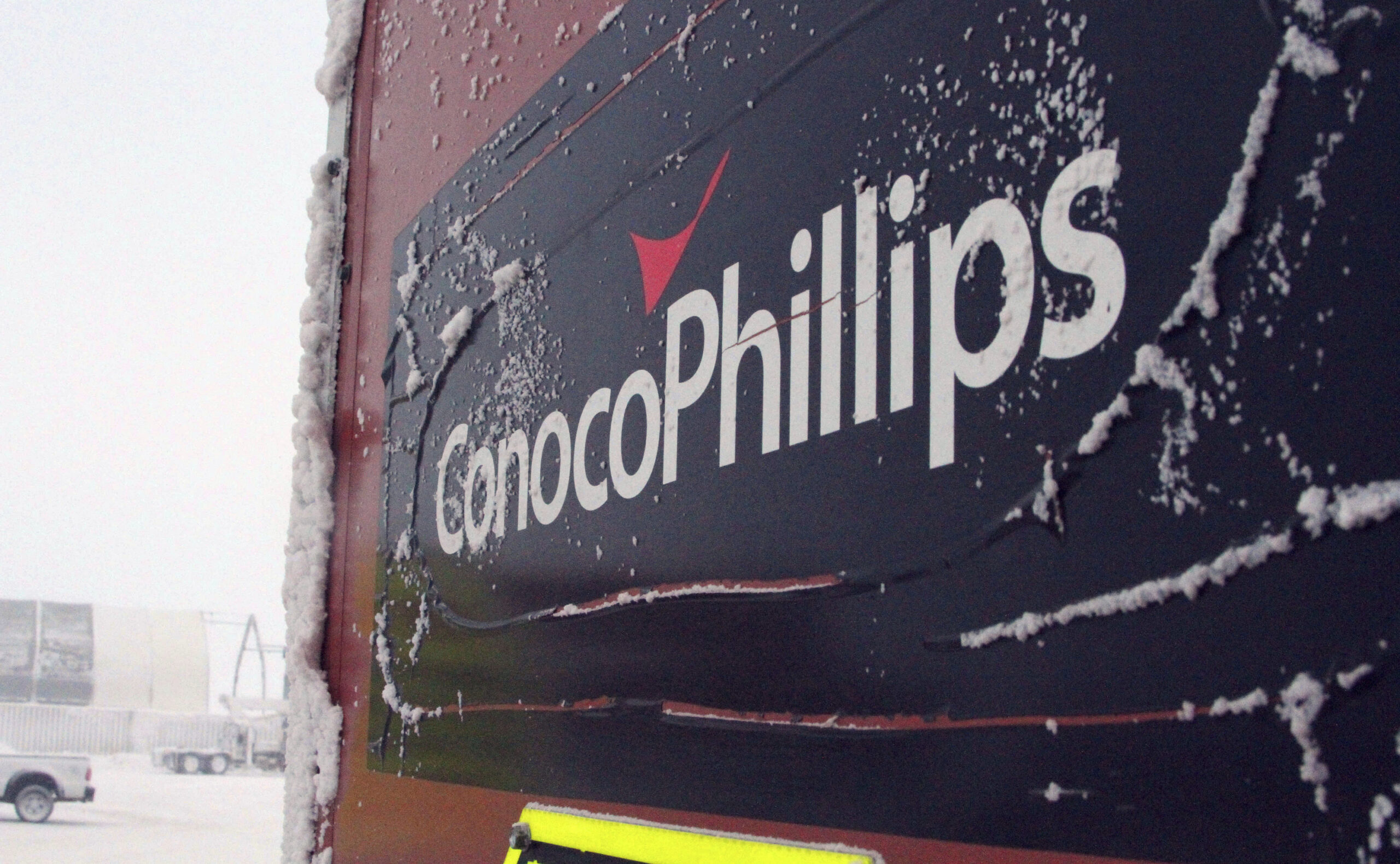 FILE - An ice-covered ConocoPhillips sign is displayed at the Colville-Delta 5, more commonly known...