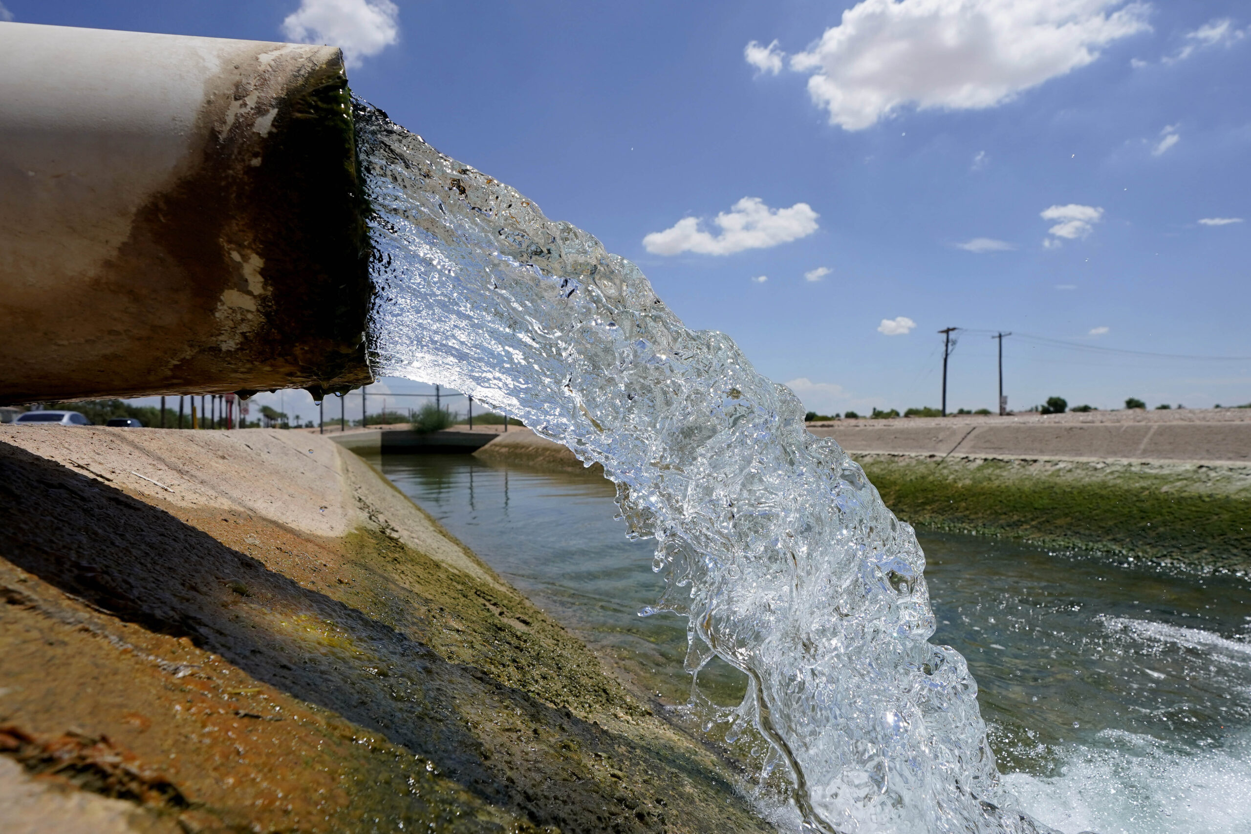 FILE - Water from the Colorado River diverted through the Central Arizona Project fills an irrigati...