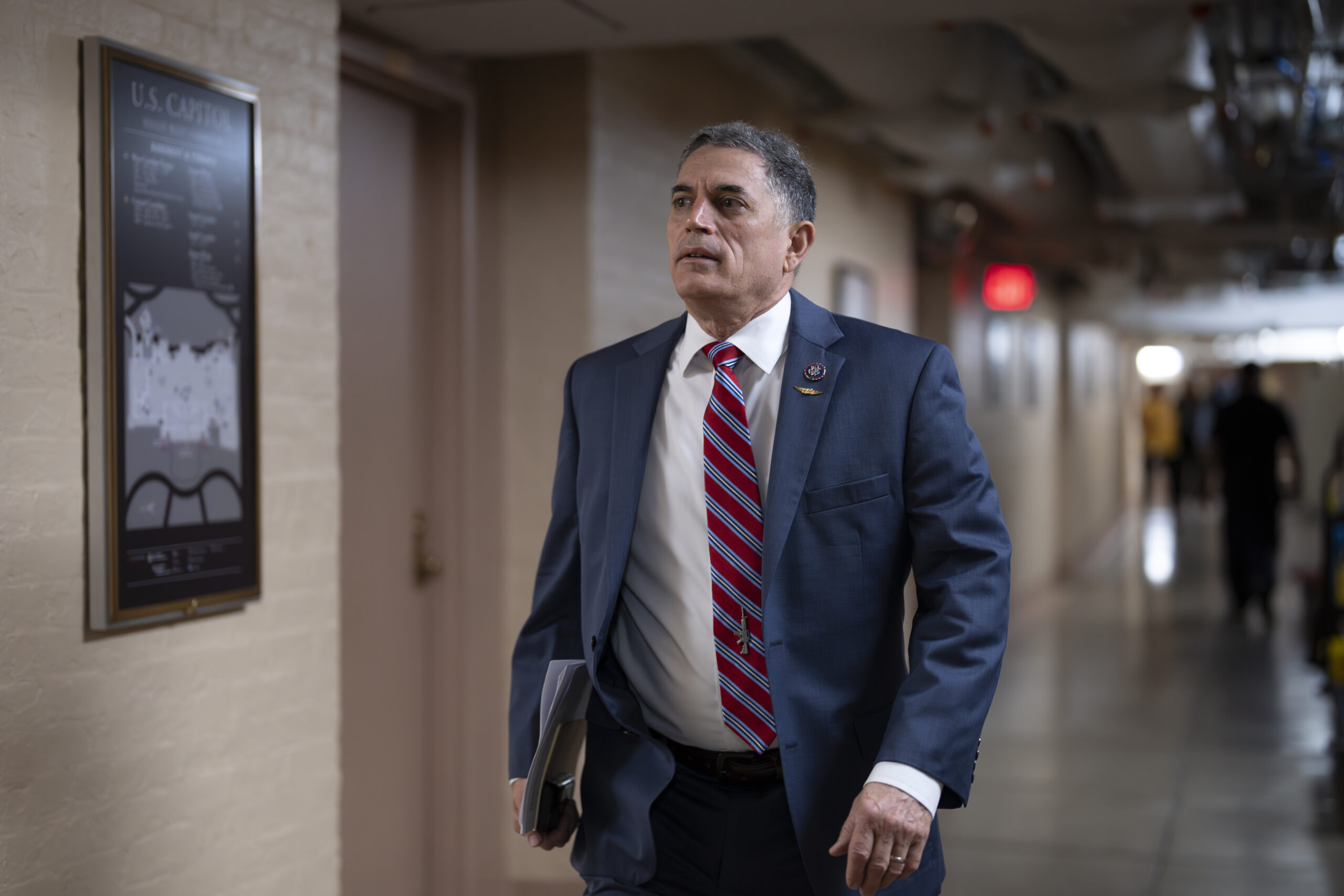 Rep. Andrew Clyde, R-Ga., walks to a closed-door meeting with Speaker of the House Kevin McCarthy, ...