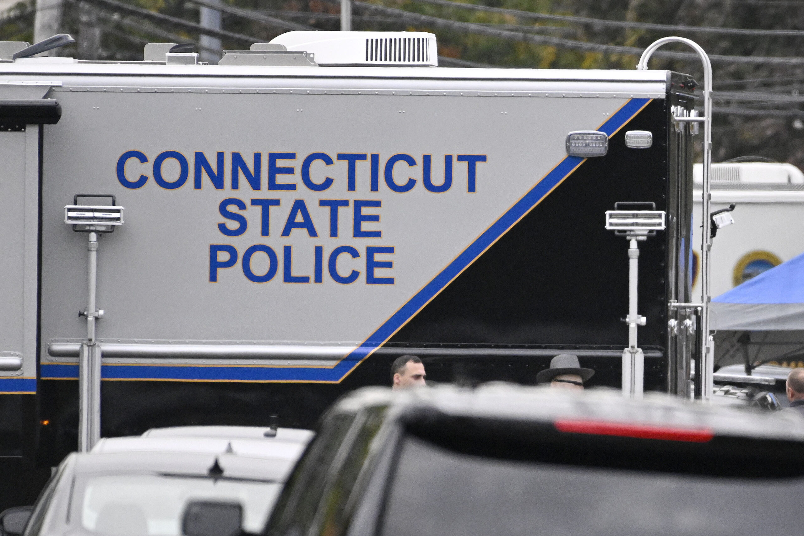 FILE - Members of the Connecticut State Police Major Crime Unit on scene where two police officers ...