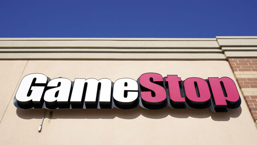 FILE - In this file photo, a GameStop sign is displayed above a store in Urbandale, Iowa, on Jan. 2...