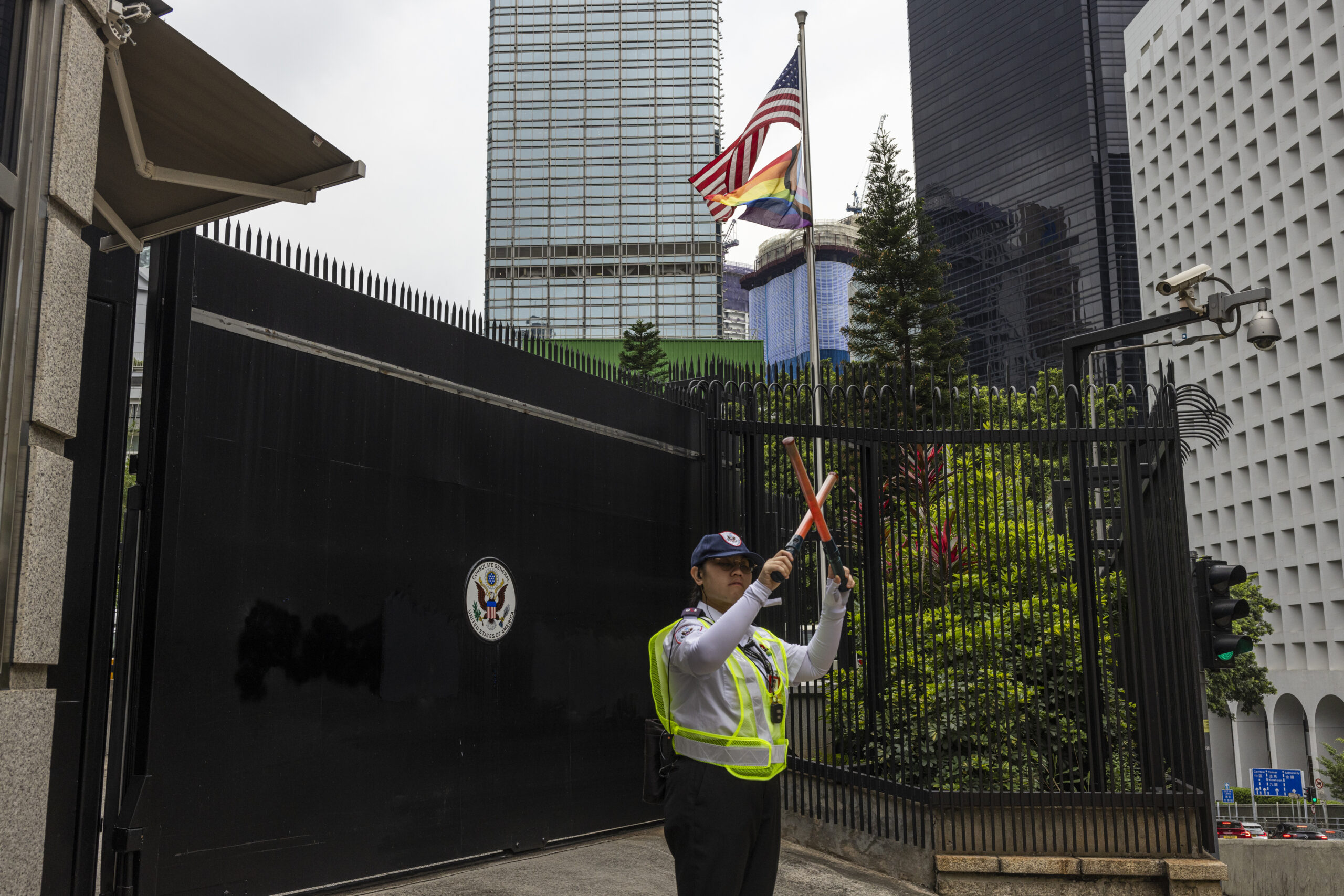 A security guard stands outside the Consulate General of the United States after it was vandalized ...