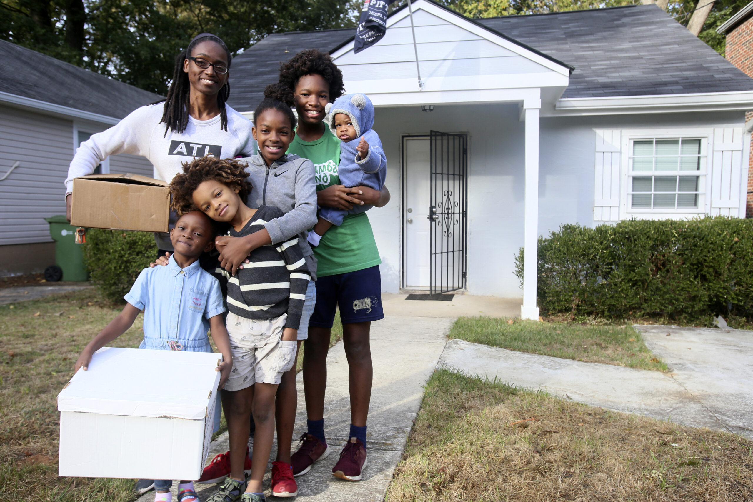This image provided by Atlanta Land Trust shows Makeisha Robey, left, and her children posing in fr...