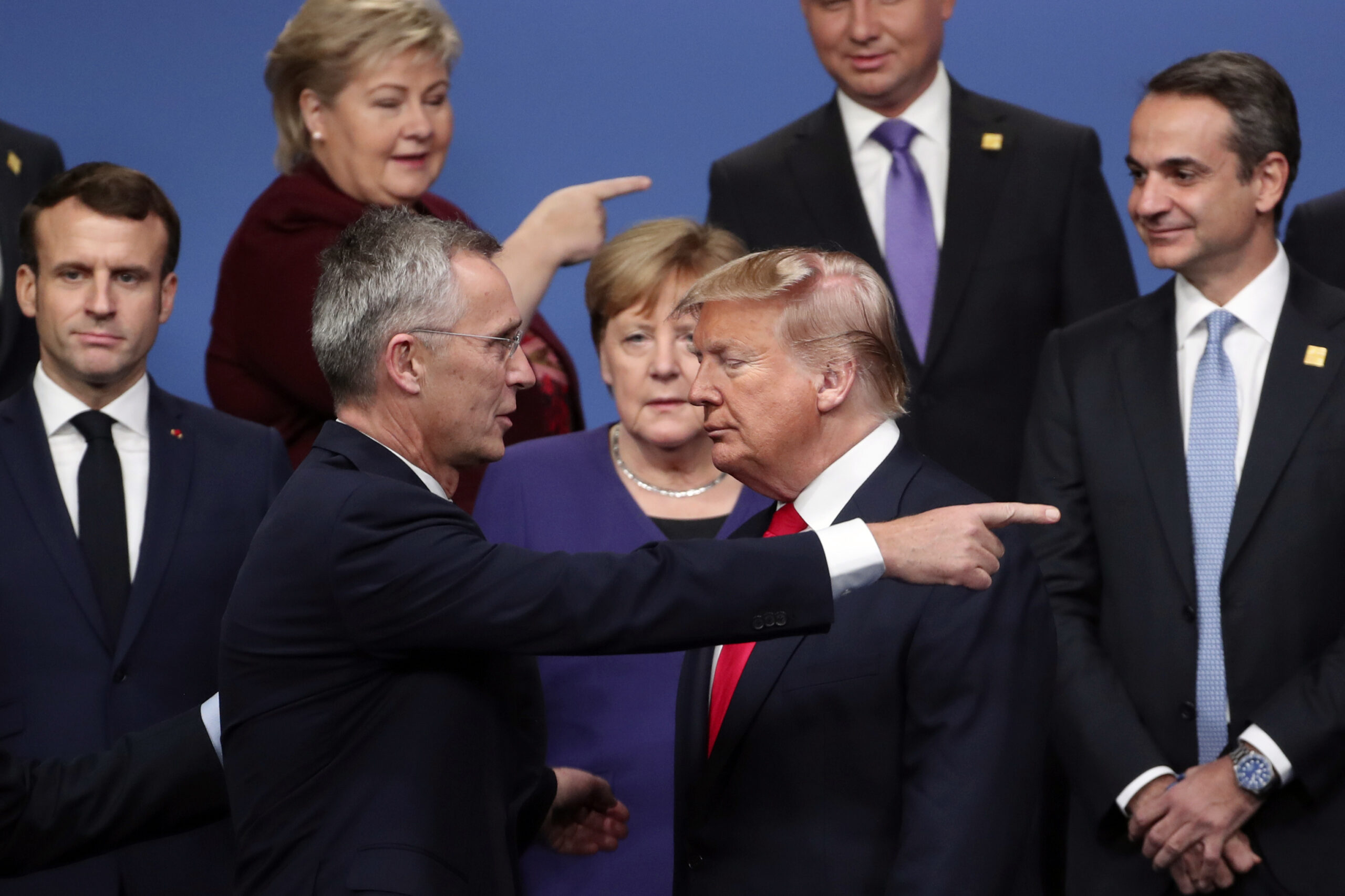 FILE - NATO Secretary-General Jens Stoltenberg, front center left, speaks with U.S. President Donal...