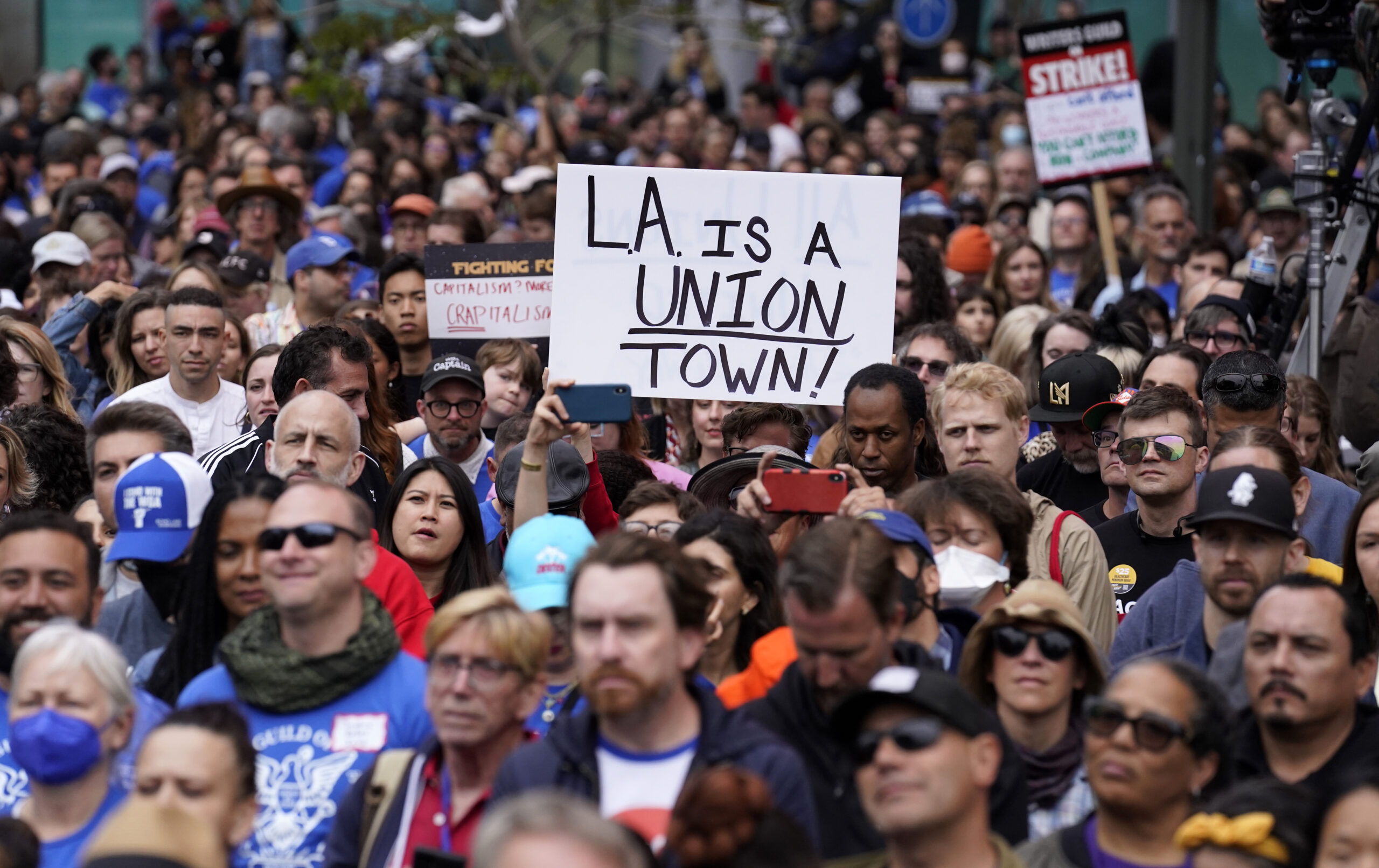 Crowd members listen to a speaker during the "Unions Strike Back" rally, Friday, May 26, 2023, near...