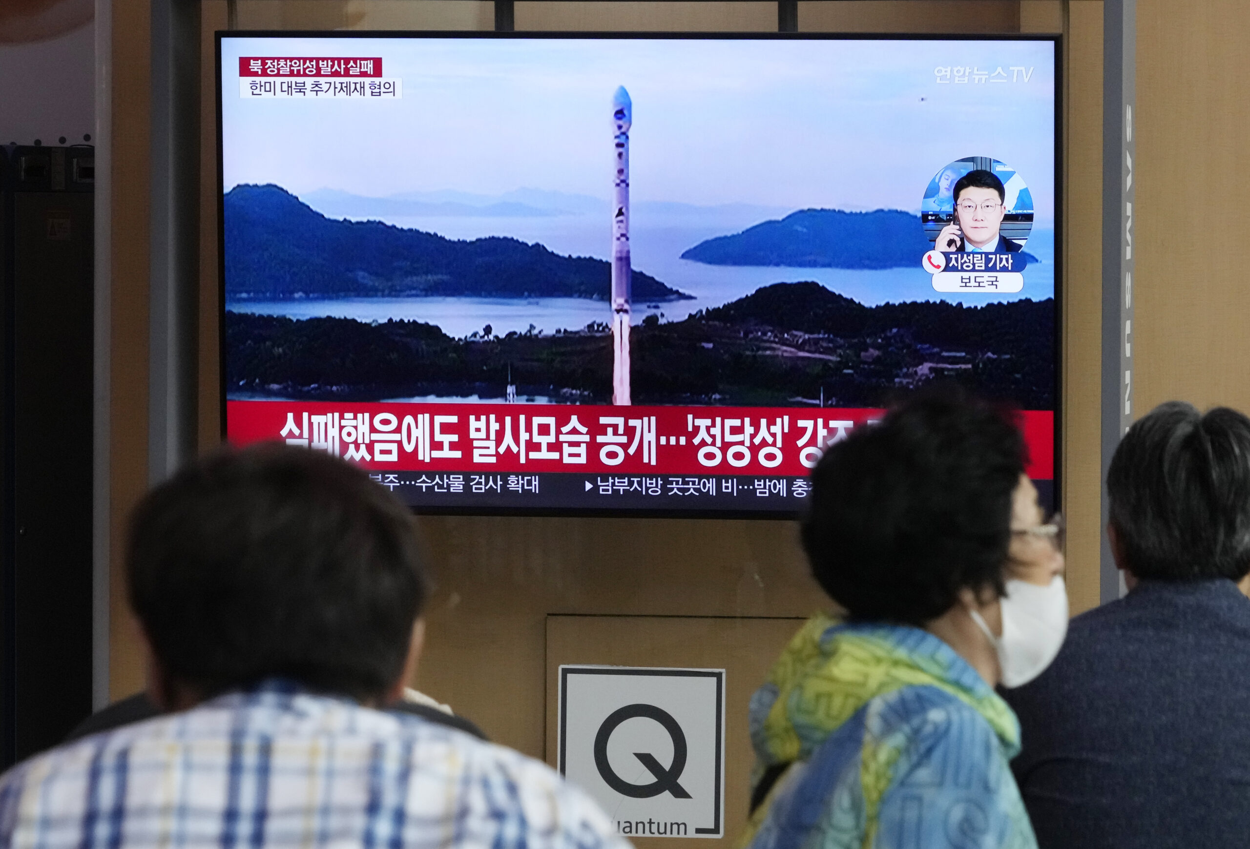 FILE - A TV screen shows an image of North Korea's rocket launch during a news program at the Seoul...