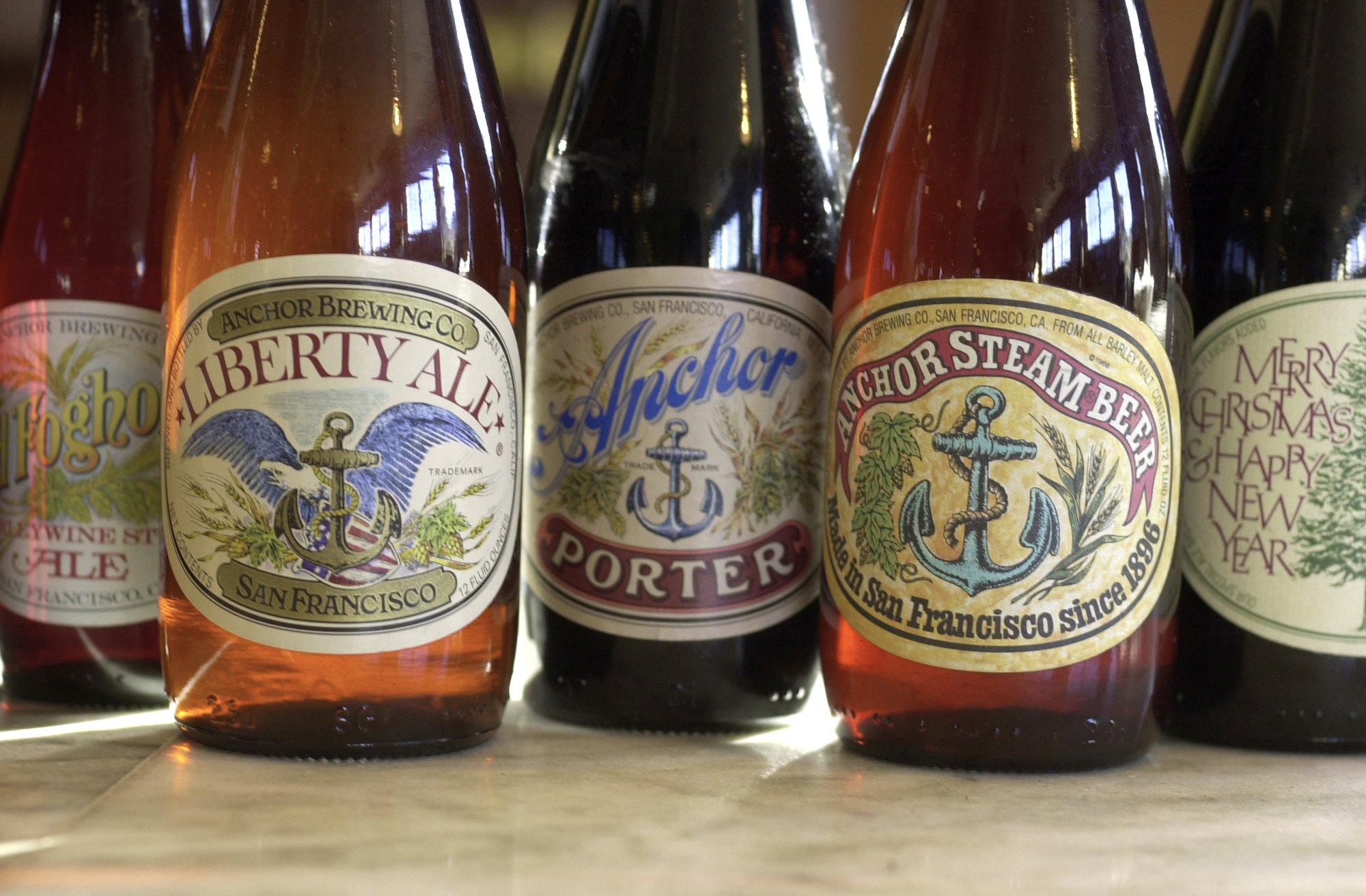 FILE - In this 2004 file photo, a number of artisan beers made at Anchor Brewing Co. are dsiplayed ...