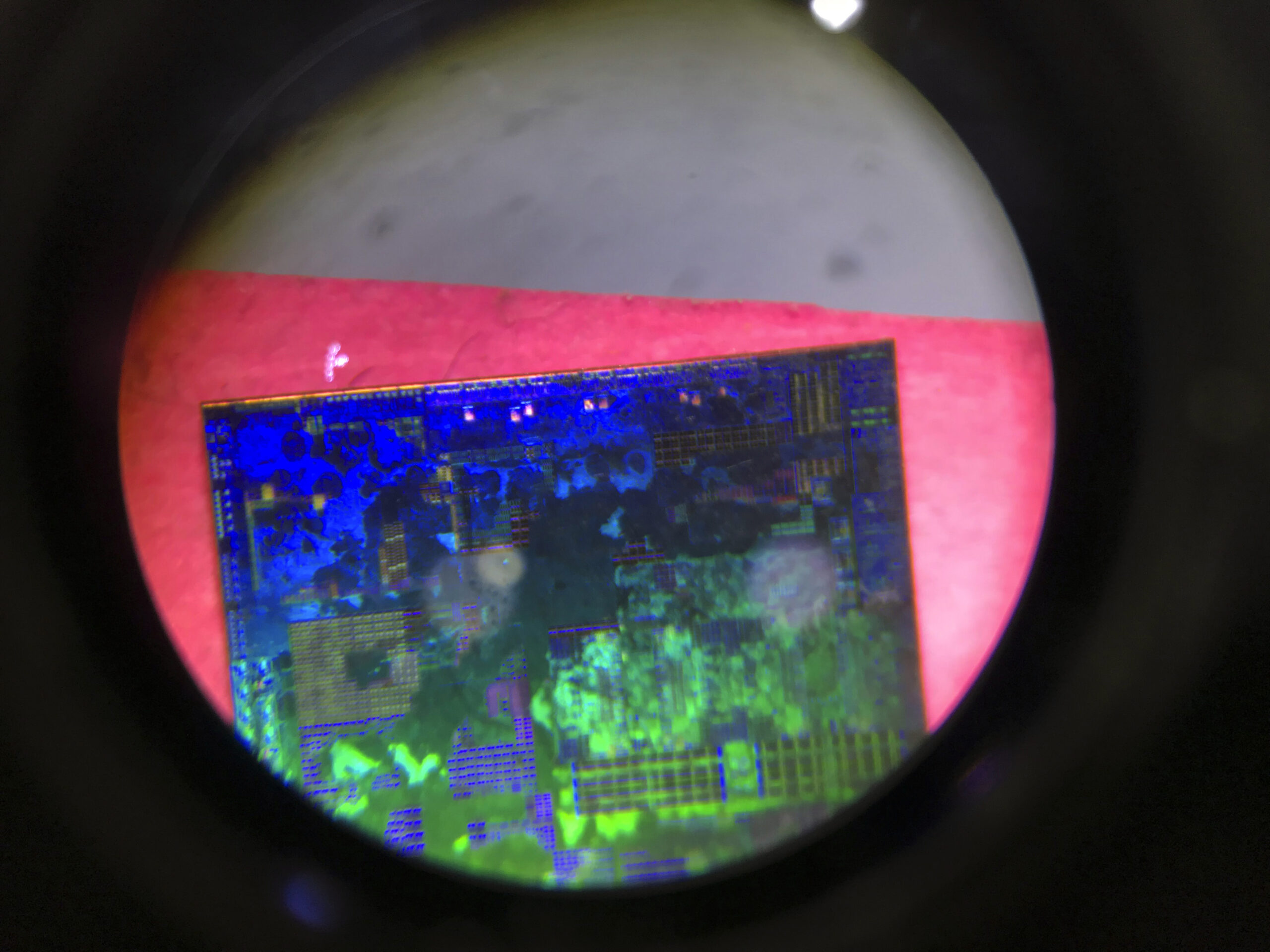 FILE - A Chinese microchip is seen through a microscope set up at the booth for the state-controlle...
