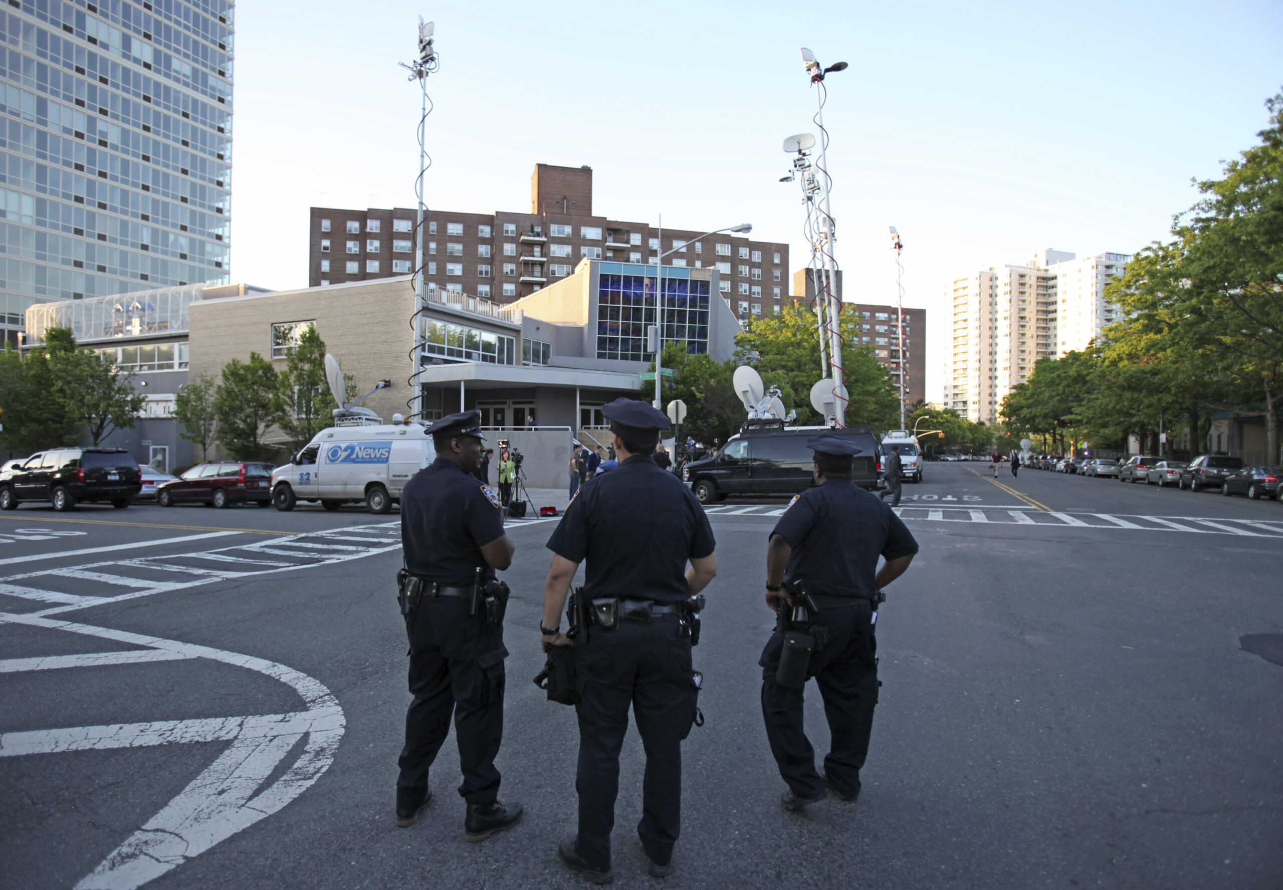 FILE - New York City police officers stand guard outside the Riverdale Jewish Center, Thursday May ...