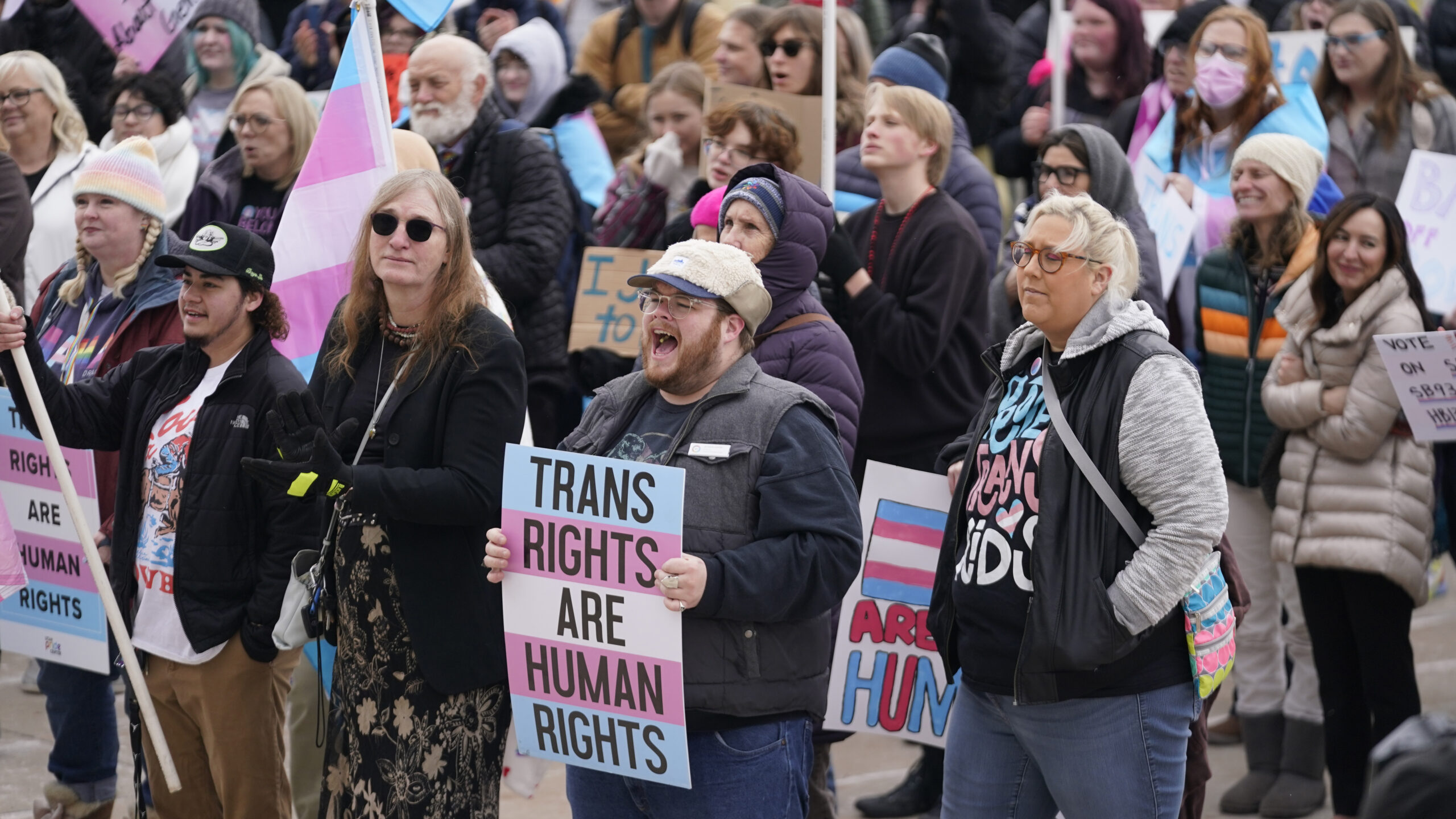 FILE -People gather in support of transgender youth during a rally at the Utah State Capitol Tuesda...