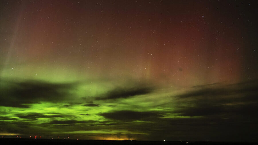 Photo: An aurora borealis, also known as the northern lights, is seen in the night sky in the early...