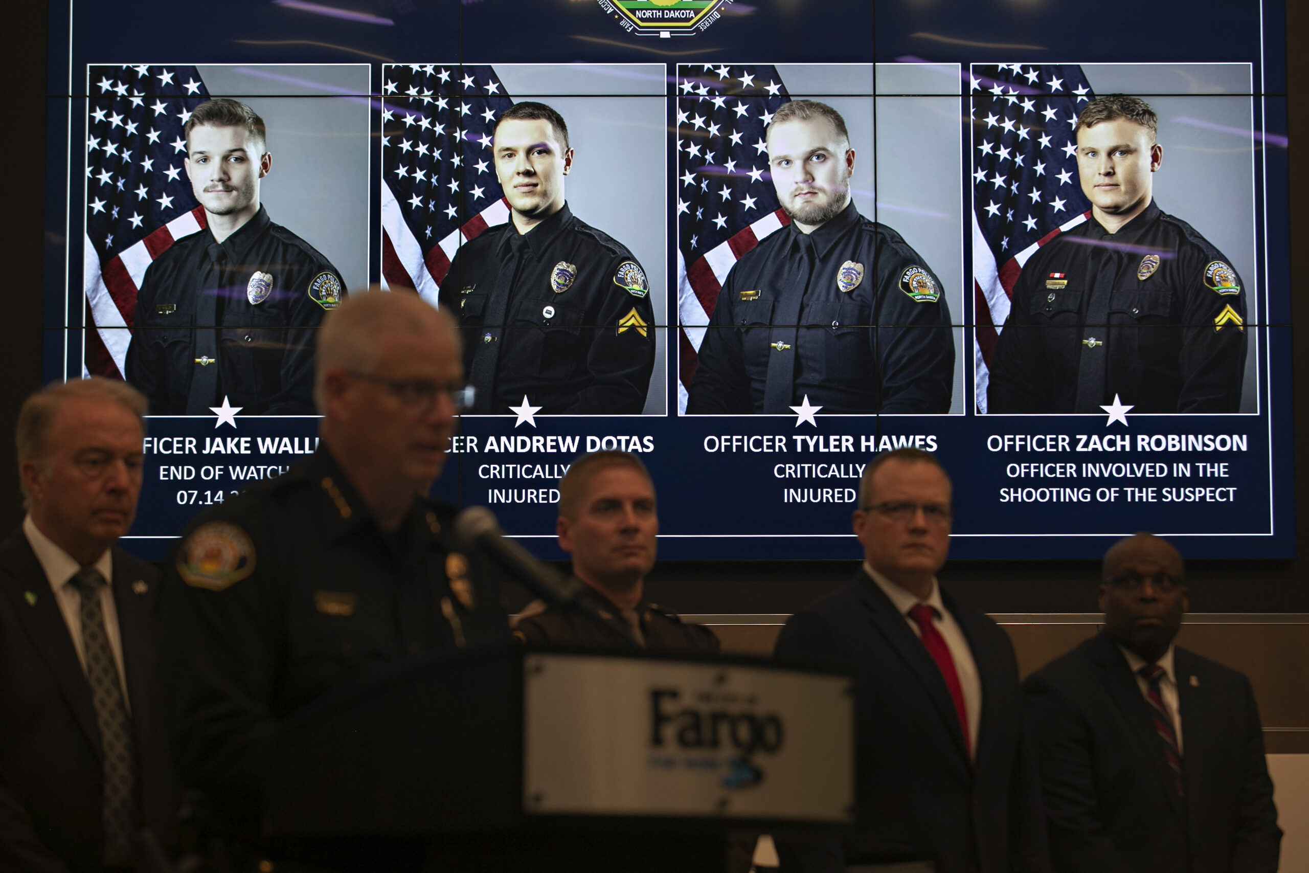 Official portraits of Fargo, N.D., police officers involved in a shooting a day earlier are display...