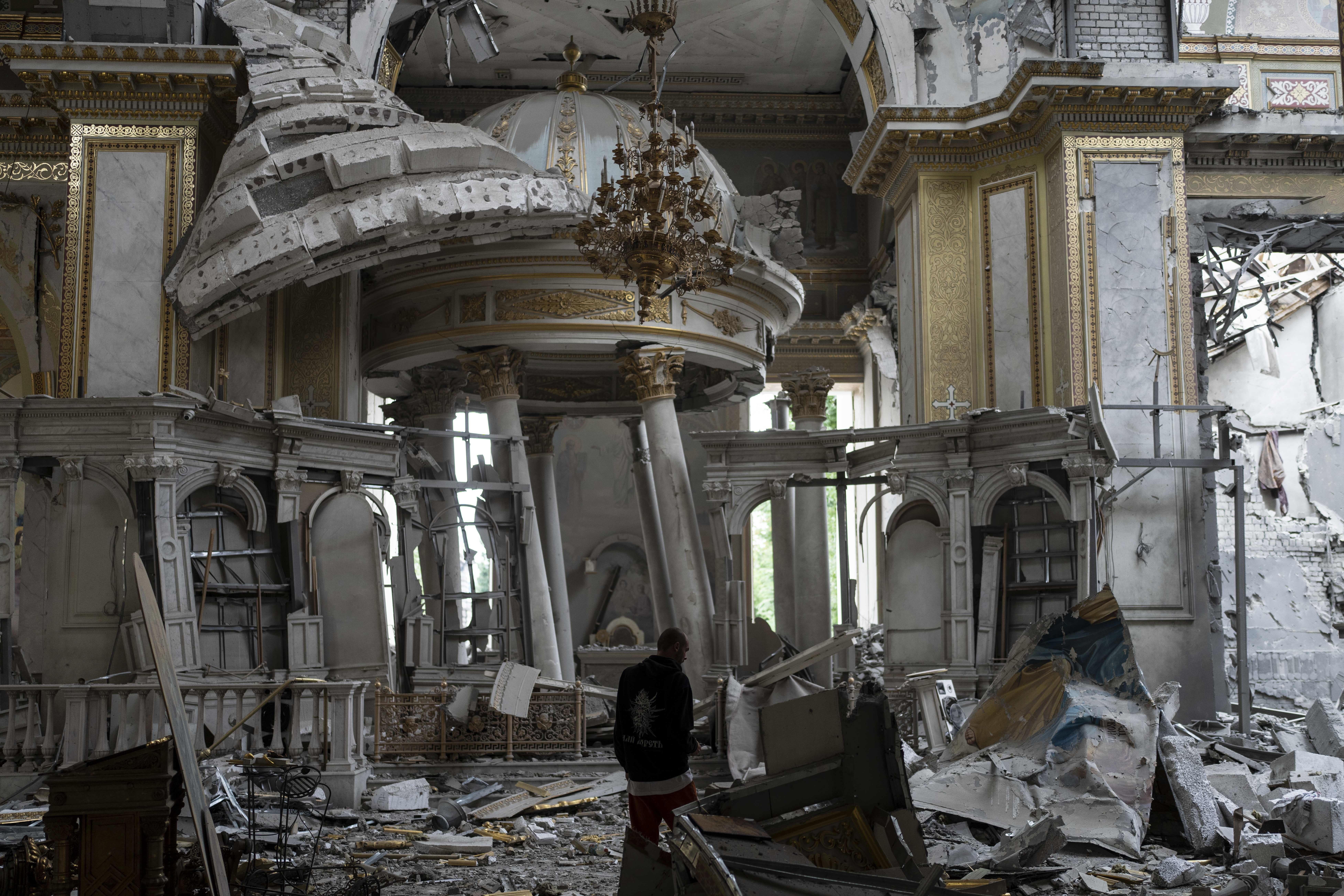 A church personnel inspects damages inside the Odesa Transfiguration Cathedral in Odesa, Ukraine, S...