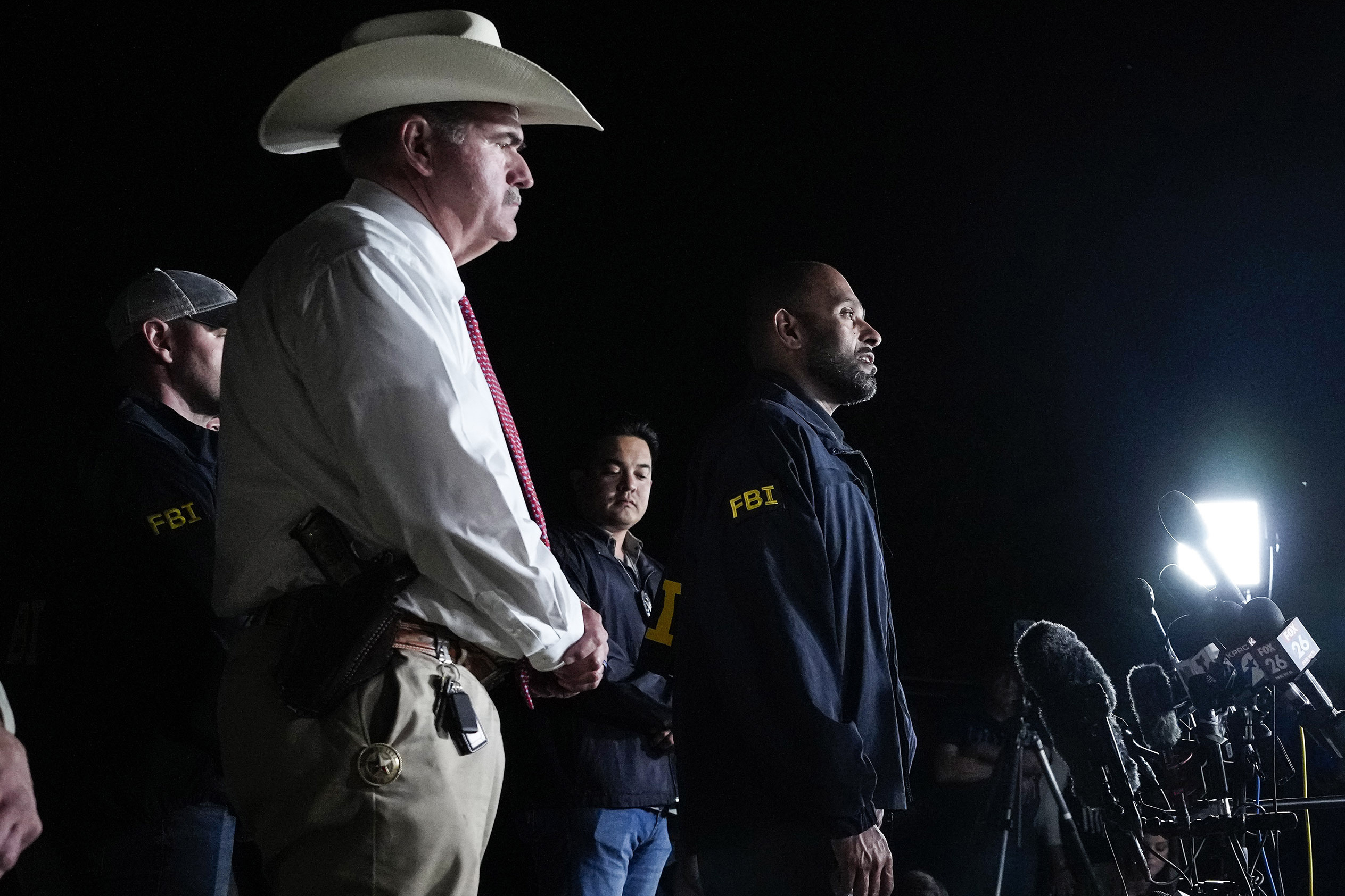 FILE - San Jacinto County Sheriff Greg Capers, left, and FBI assistant Special Agent in Charge Jimm...