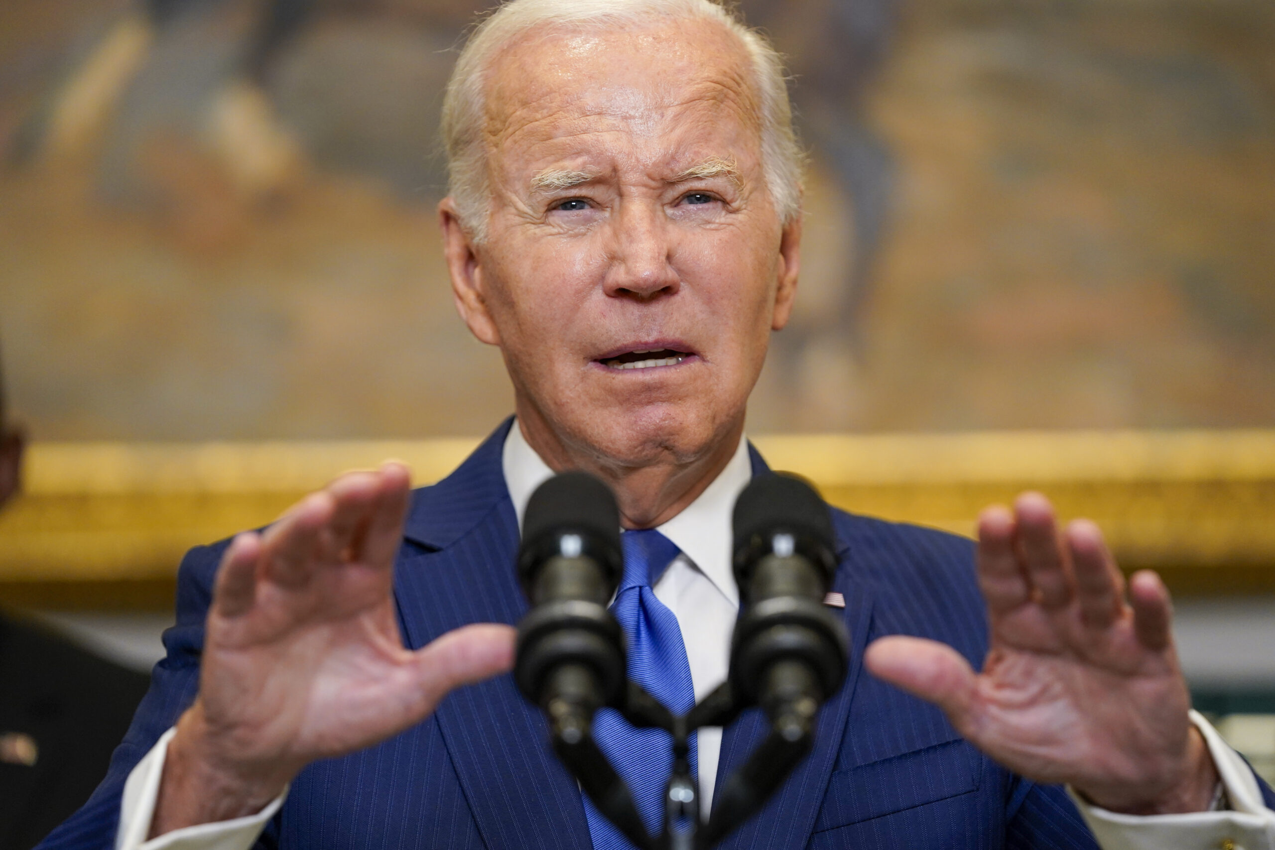 President Joe Biden, center, delivers remarks on recovery efforts for the Maui wildfires and the re...