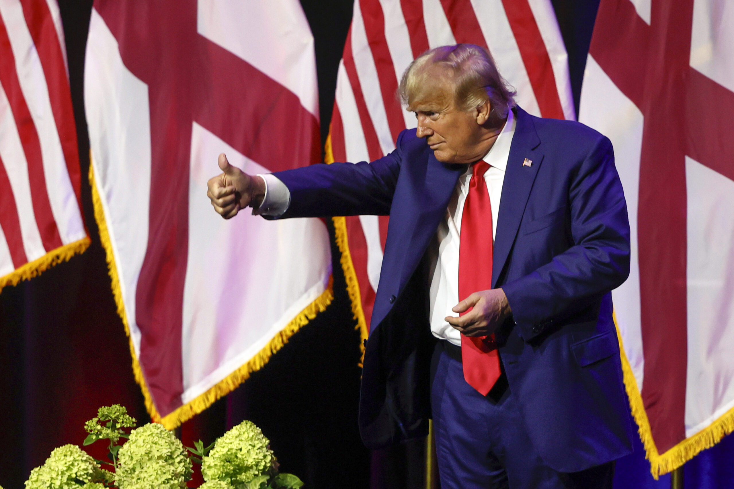 Former President Donald Trump gestures after speaking at a fundraiser event for the Alabama GOP, Fr...