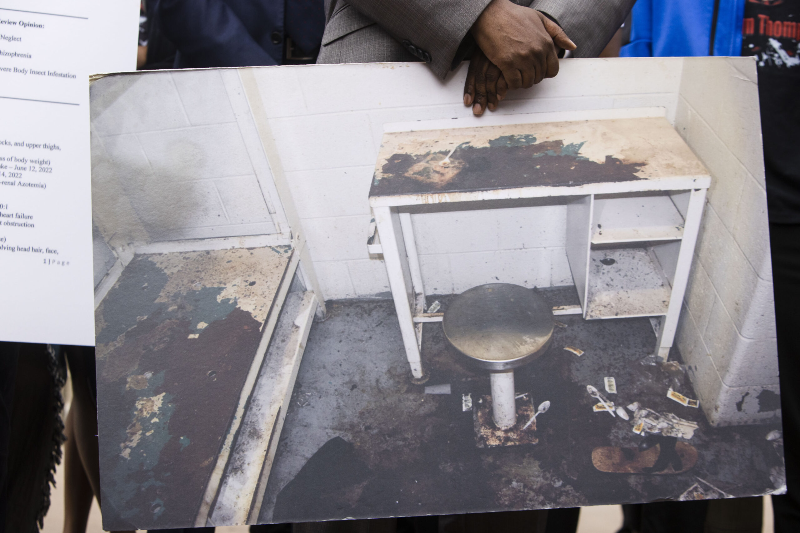 FILE - Attorney Michael Harper holds a photo of Lashawn Thompson's cell in the Fulton County, Ga., ...