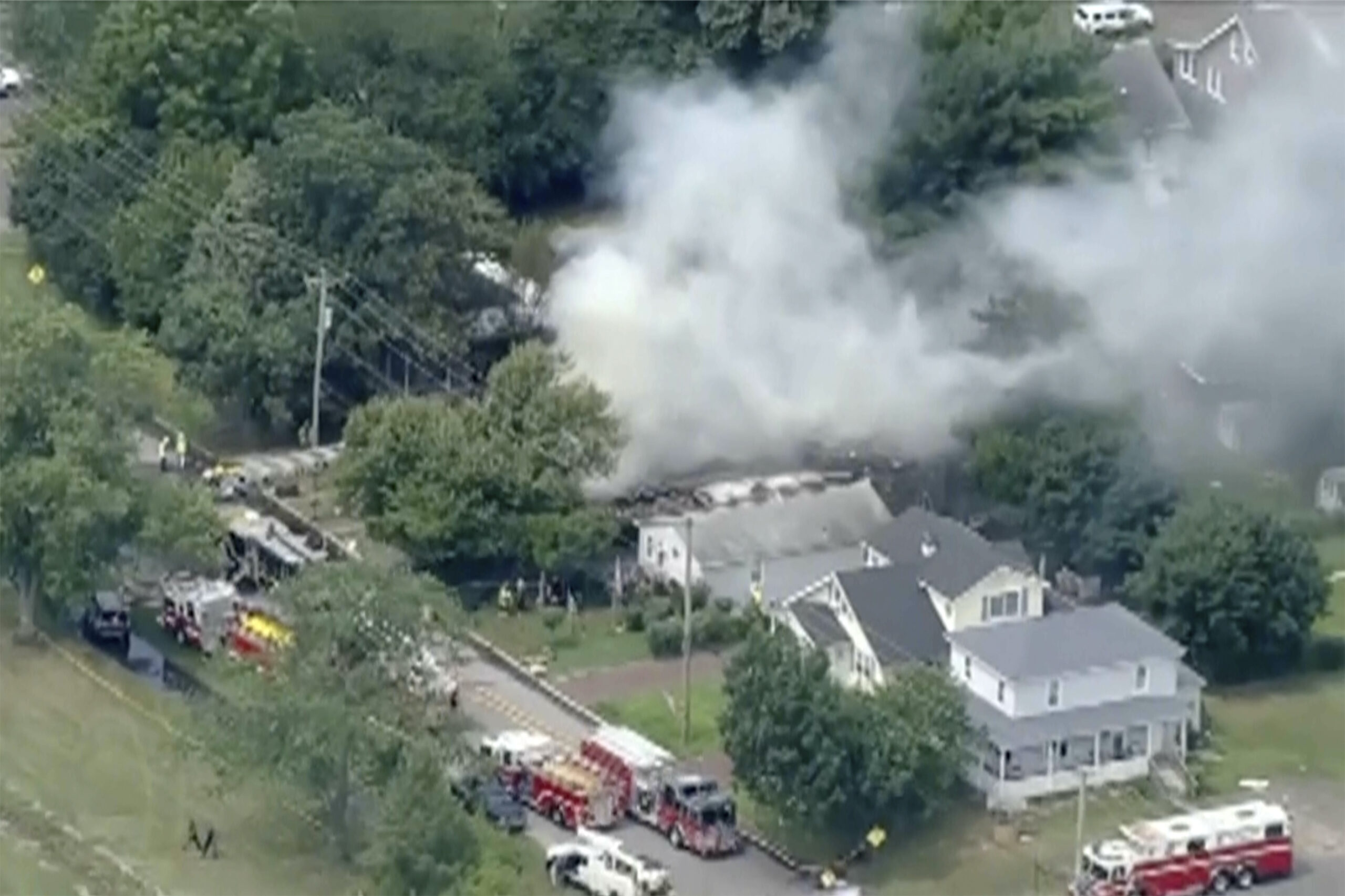 In this image taken by video from WPVI, fire crews try to extinguish an fire at a home Thursday, Au...