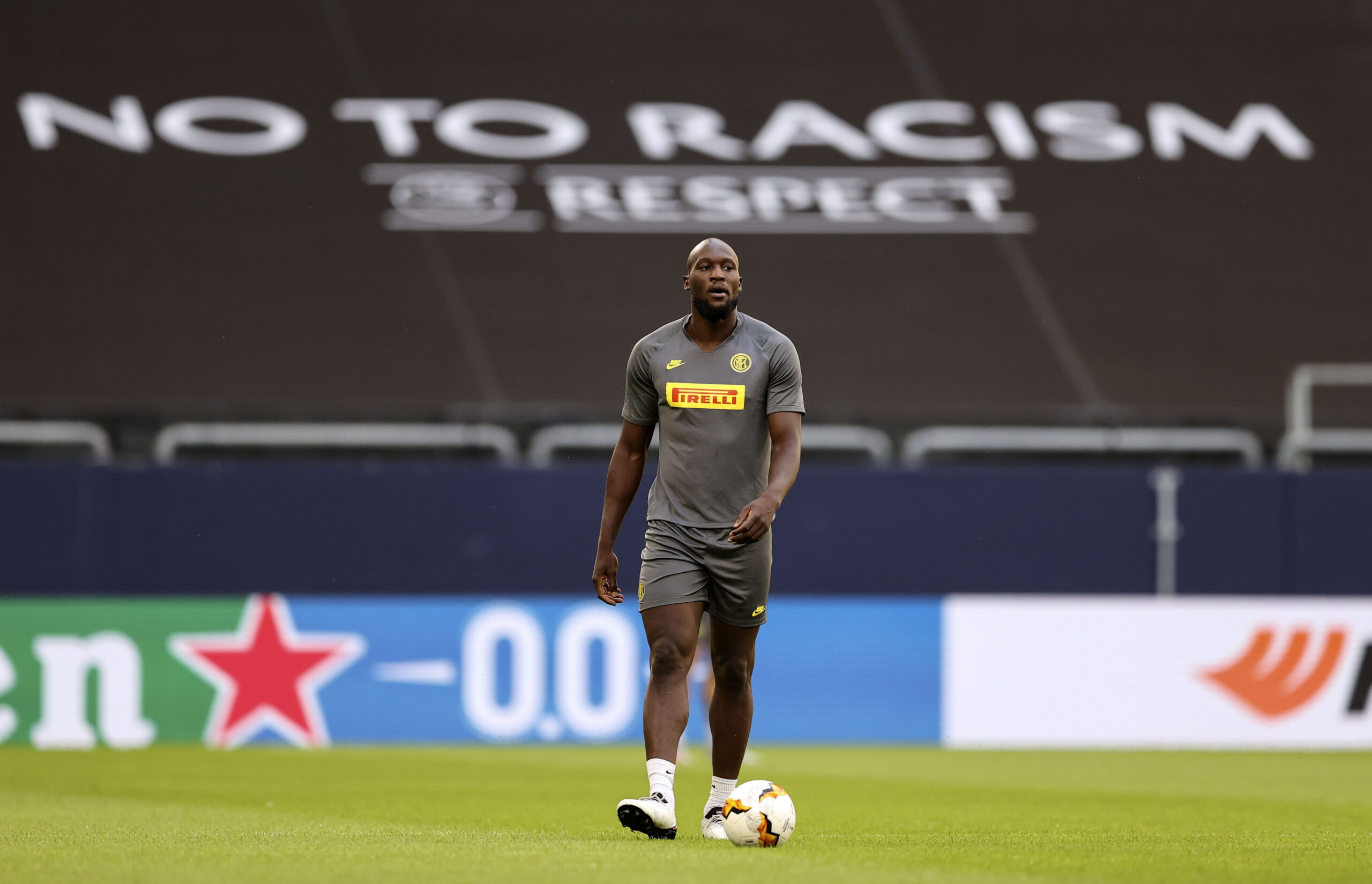 FILE - Inter Milan's Romelu Lukaku walks on the pitch in front of a 'no to racism' banner during th...