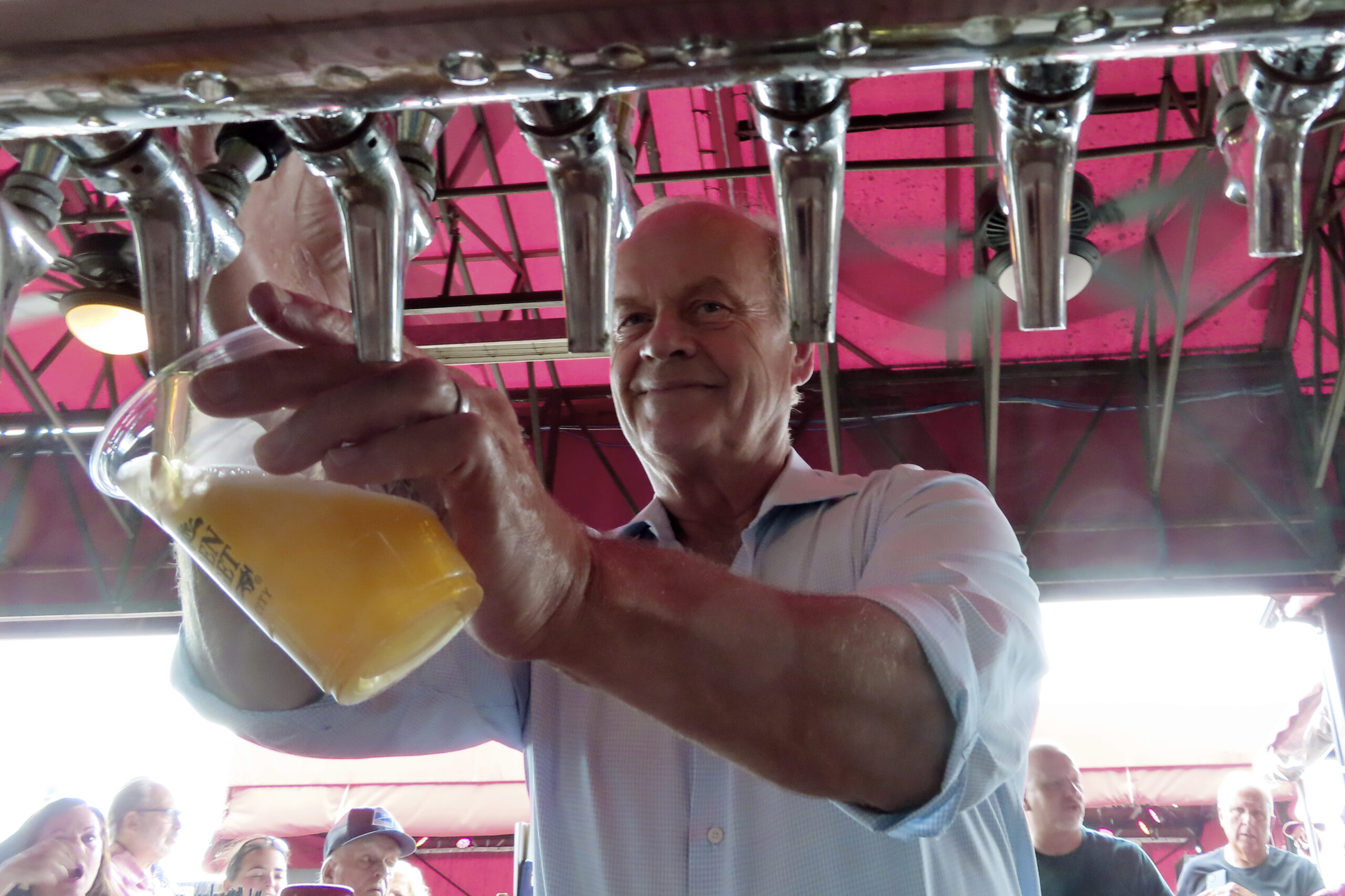 Actor Kelsey Grammer pours beers during a guest bartending stint at the Golden Nugget casino in Atl...