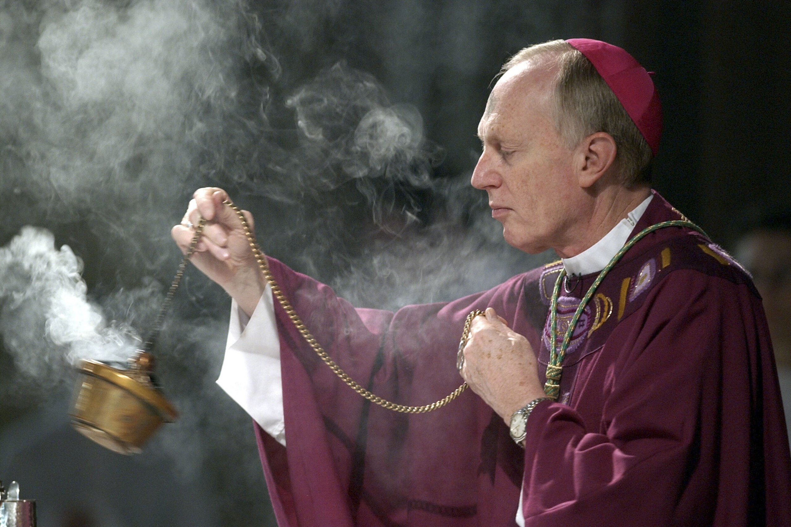 FILE — Bishop Howard Hubbard swings incense during an Ash Wednesday communion service, at the Cat...