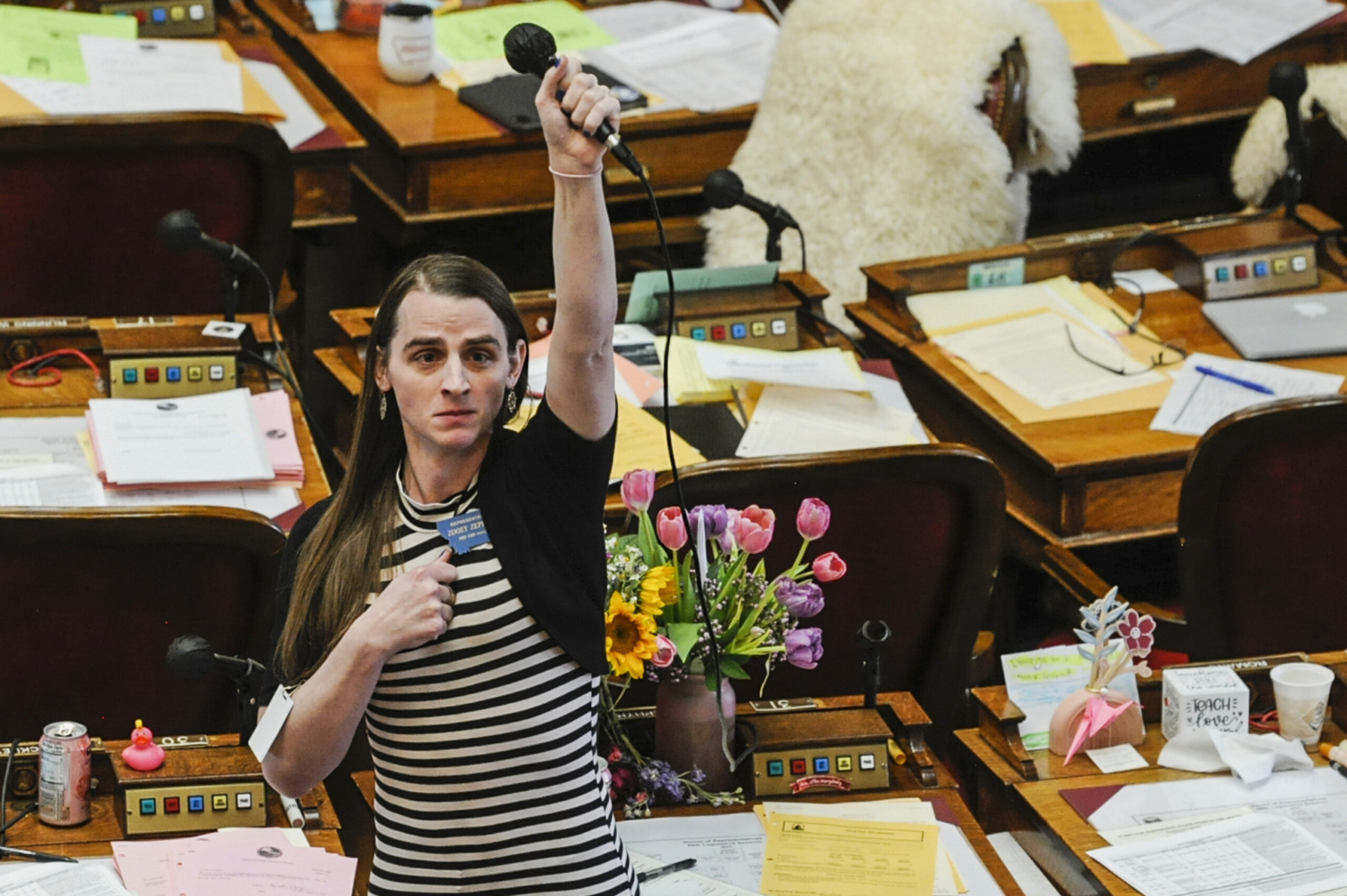 FILE - Montana Rep. Zooey Zephyr, D-Missoula, alone on the House floor, stands in protest as demons...