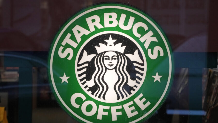 Photo: The Starbucks sign is displayed in the window of a Starbucks, Jan. 30, 2023....